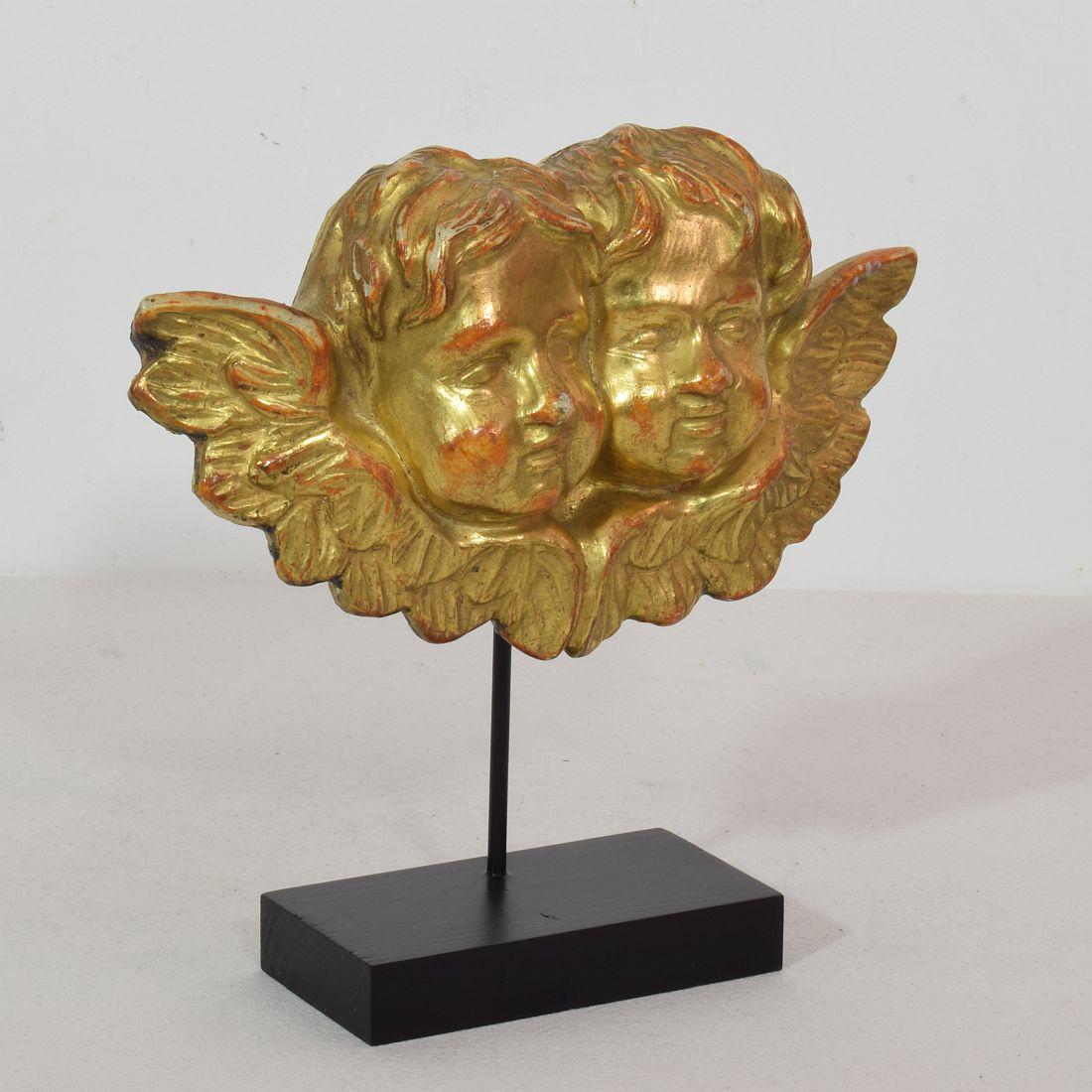 Beautiful giltwood winged angelheads.
Italy, circa 1750
Weathered. This ornament was once part of a larger panel.
Measurement here below inclusive the wooden base.