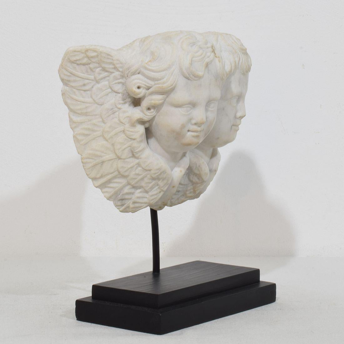 Hand-Carved Italian, 18th Century Carved White Marble Winged Double Angel Head Ornament For Sale