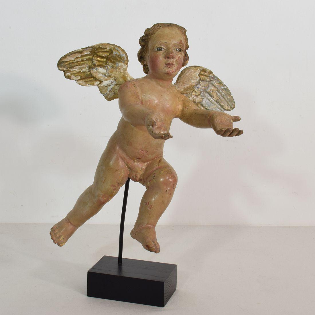 Beautiful Baroque angel with glass eyes. Unique period piece.
Italy, circa 1750
Weathered. Small losses and old repairs.
More pictures on request.
Measurement here below includes the wooden base.

  