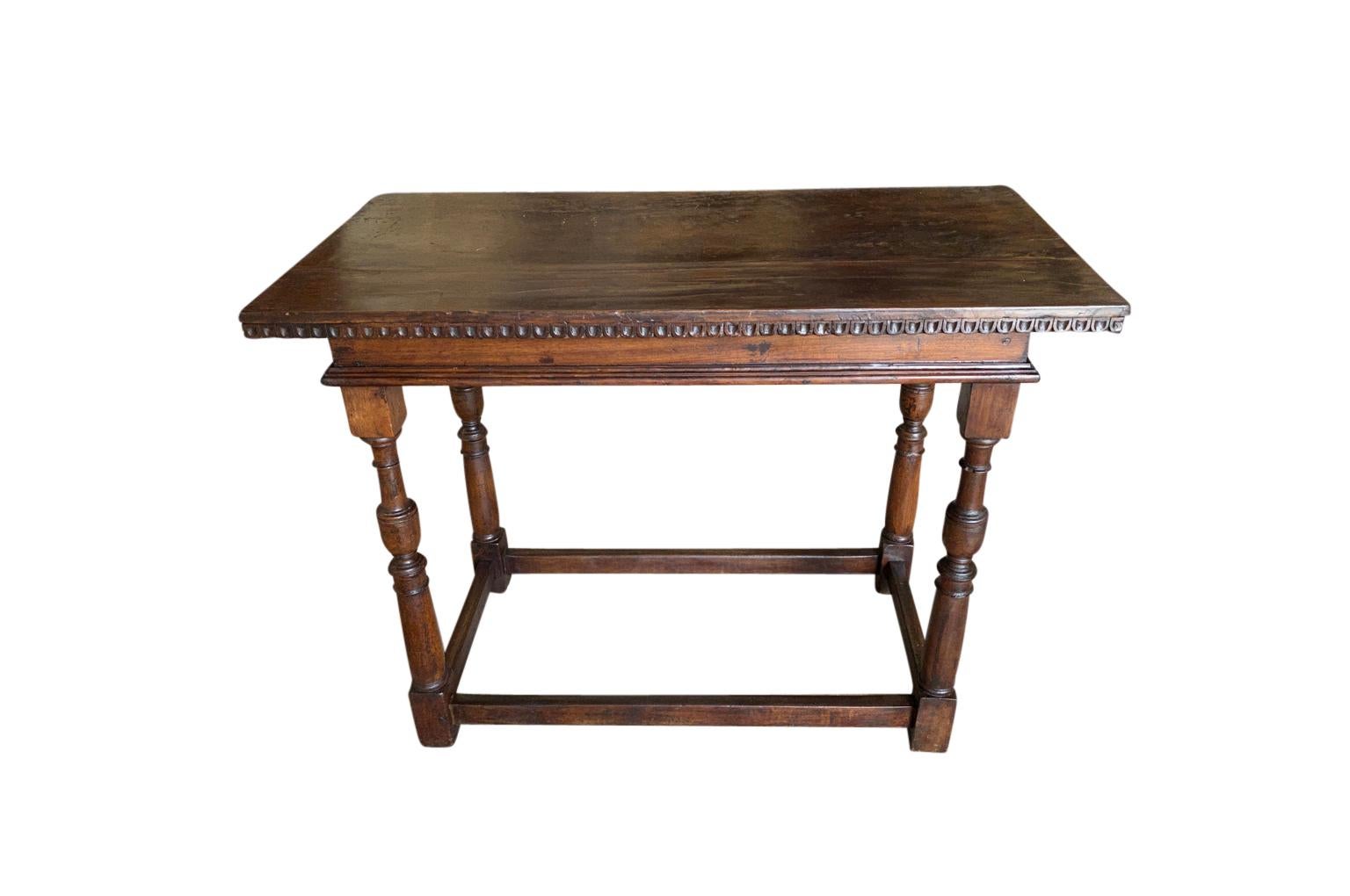 A very handsome 18th century Console Table from the Lombardy region of Italy. Wonderfully constructed from beautiful walnut with a solid board top and nicely turned legs. Terrific patina - rich and luminous.