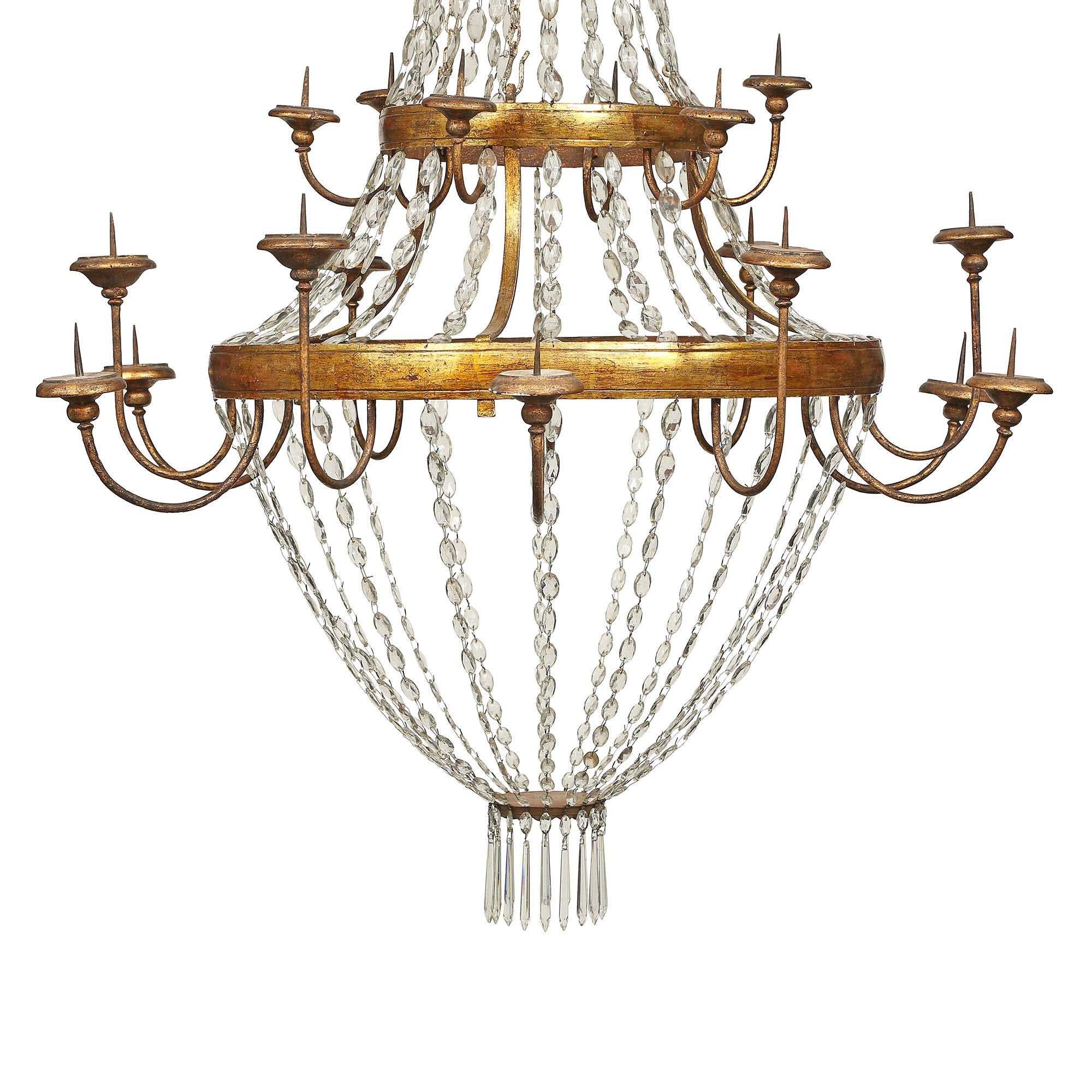 Italian 18th Century Gilt Metal, Gilt Wood And Patinated Wood Sixteen Light Chan In Good Condition For Sale In West Palm Beach, FL