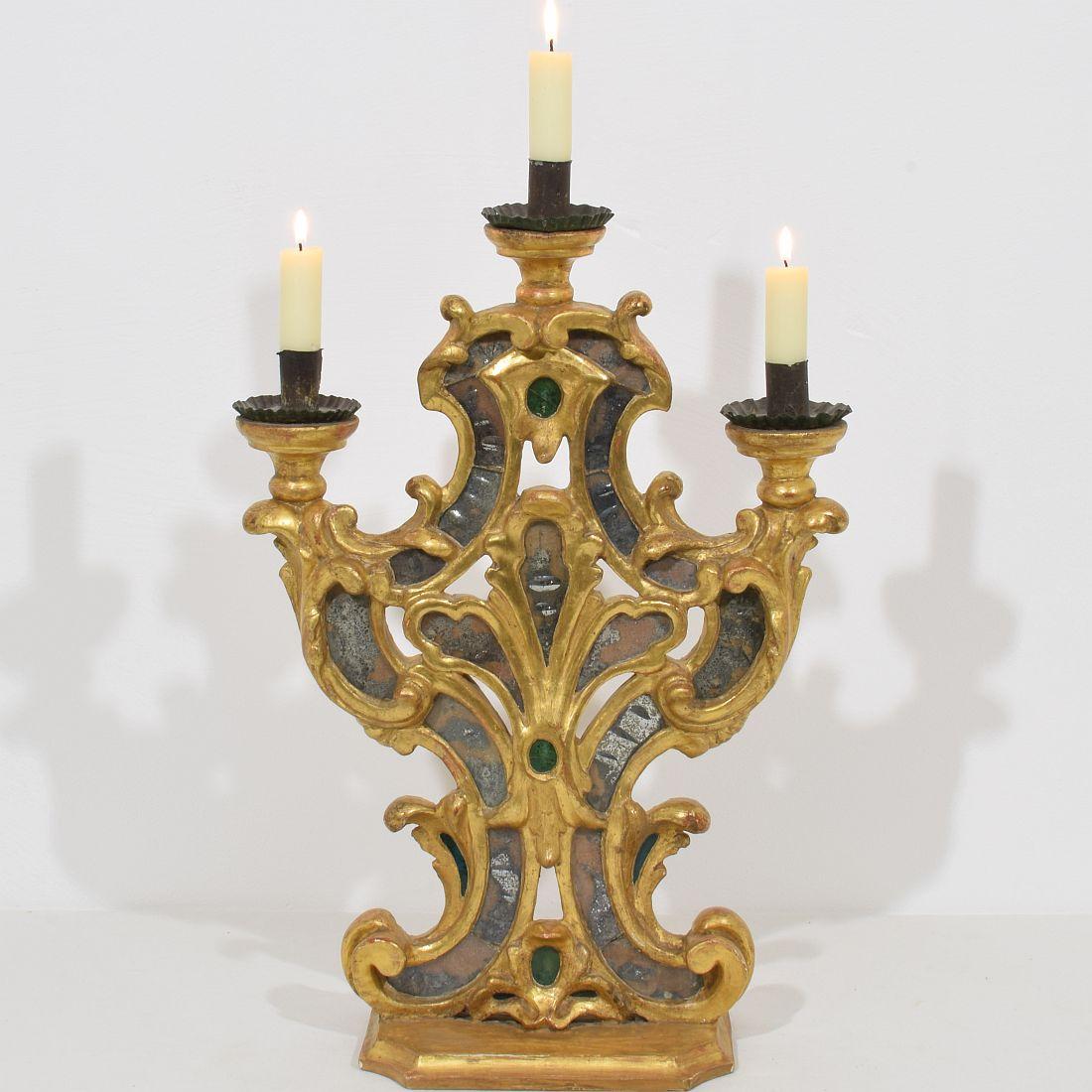 Unique Baroque giltwood candleholder with mirrors.
 Italy, circa 1750. Weathered and small losses.