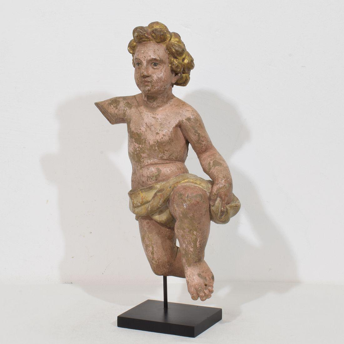 Beautiful hand carved Baroque angel fragment. Unique period piece with traces of its old color .
Italy, circa 1750
Weathered. small losses. 

Measurement here below includes the wooden base.
H:45,5cm  W:22cm D:13cm 