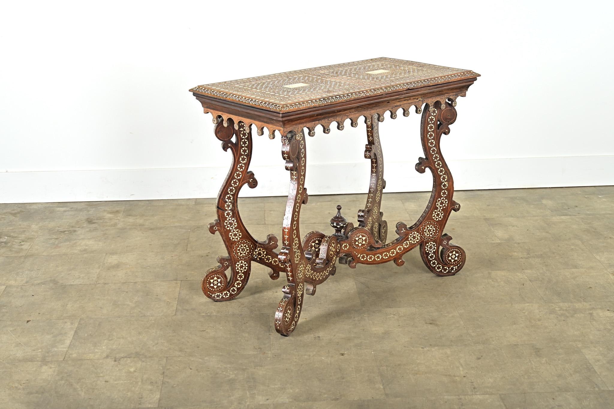 This breathtaking walnut console table from 18th century Italy is decorated with a technique of inlay known since the Middle Ages as “certosina” which uses delicate pieces of bone assembled into exquisite geometric patterns borrowed from the