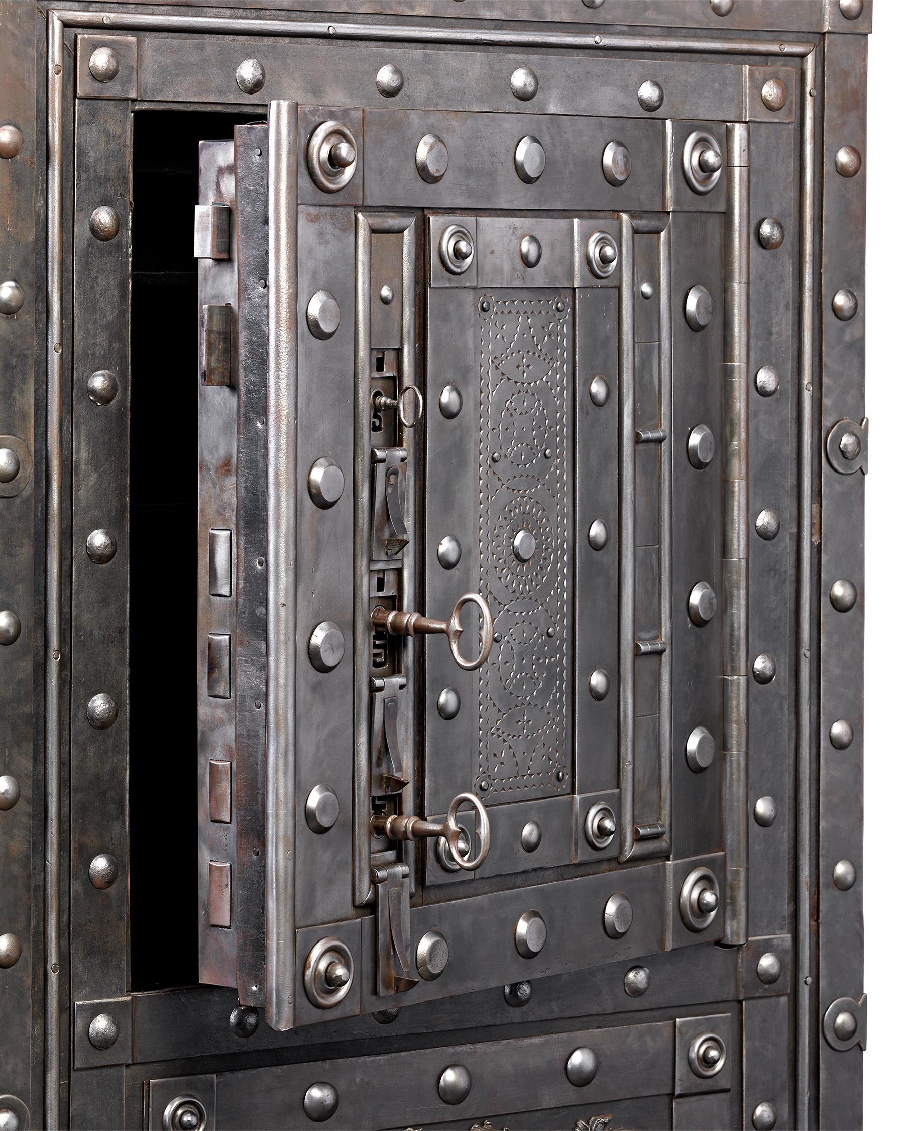 Distinguished by its intricate locking system and exceptional craftsmanship, this spacious 18th-century Italian safe provides the utmost in security. Weighing nearly 300 pounds, gaining access to the massive safe’s contents requires three keys and a