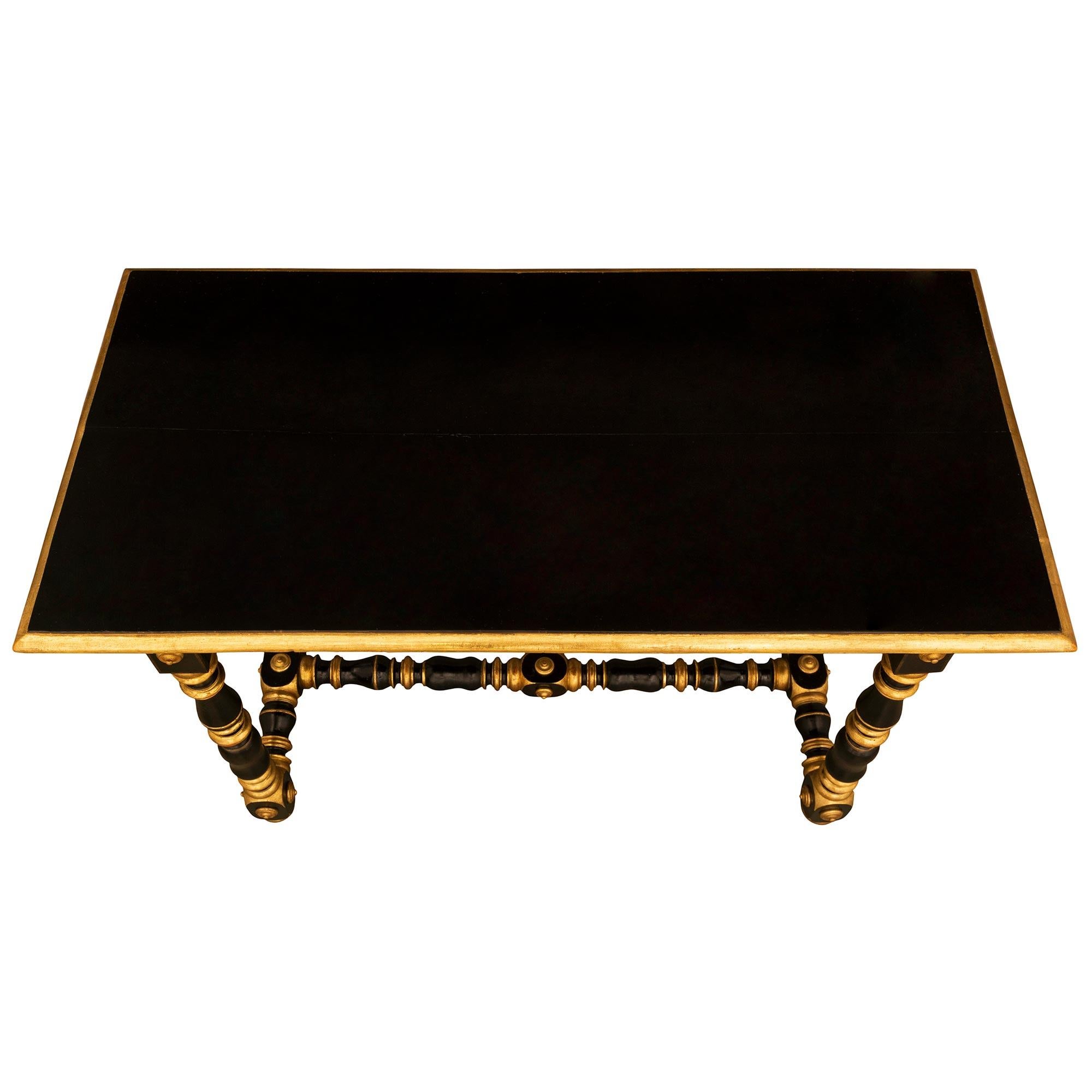 A beautiful and most unique Italian early 18th century Louis XIV period Tuscan st. ebonized Fruitwood and giltwood side/center table. The rectangular table is raised by exceptional turned legs with most decorative mottled giltwood accents and block