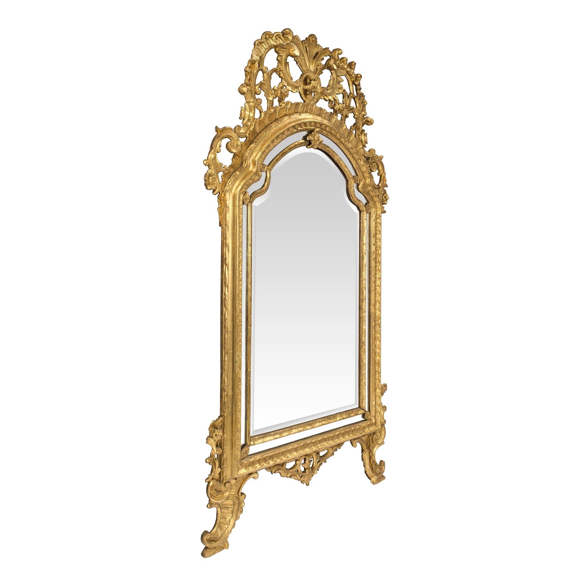 A stunning and high quality Italian 18th century Louis XIV period giltwood double framed mirror from the region of Piedmont, Turino. The elegant mirror is raised by ‘S’ scrolled legs with gilt acanthus leaves and a pierced central reserve. The two