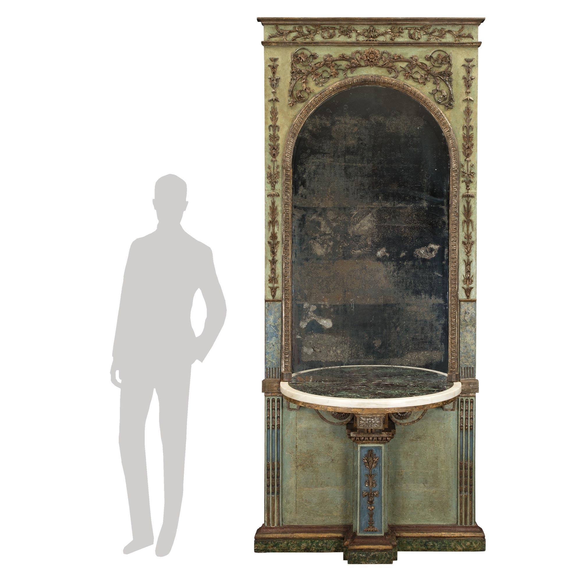 A remarkable and unique Italian 18th century Louis XIV period mecca and patinated mirror and marble console from a Genovese Carpenteria. The mirror is raised on a slim faux marble painted plinth with moulded borders. Above is the built in console