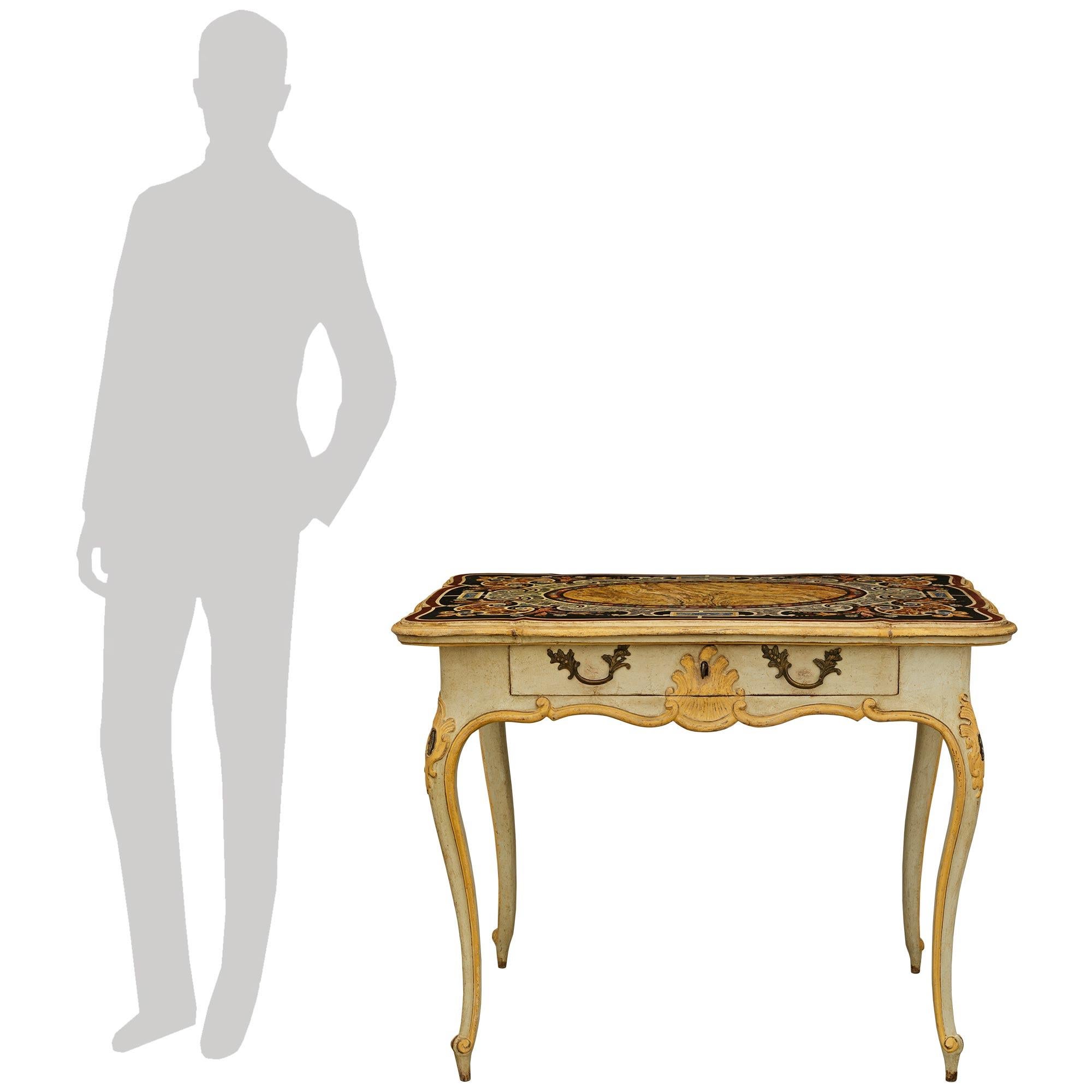 An impressive and most decorative Italian 18th century Louis XV Period patinated Wood and Scagliola side table/desk. This wonderfully detailed rectangular table is raised on patinated off-white legs accented with patinated yellow borders and leading