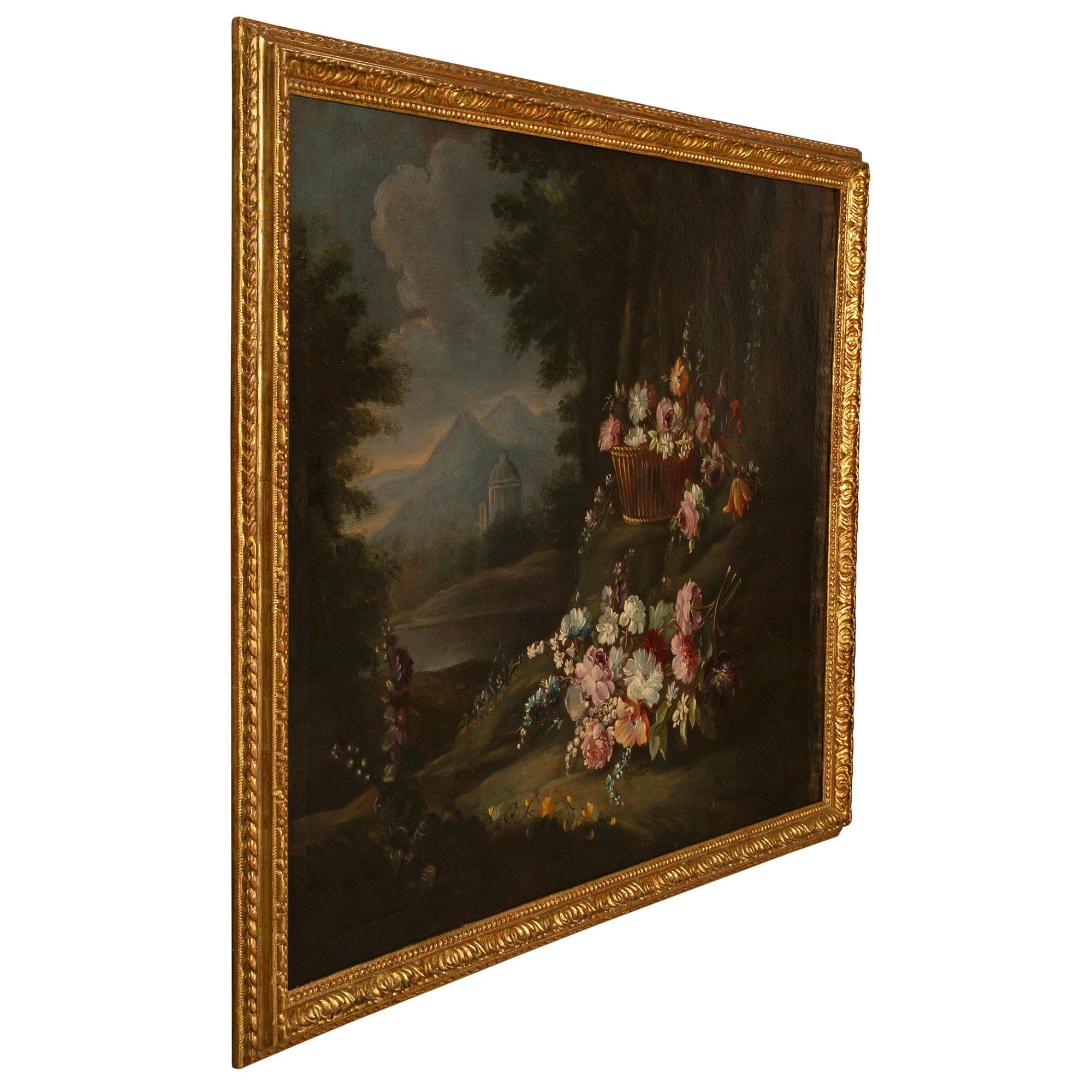 A beautiful and charming Italian 18th century Louis XVI period oil on canvas still life painting in its original giltwood frame. The painting depicts wonderfully executed and finely detailed colorful flowers on a clearing in the forest. Assembled in