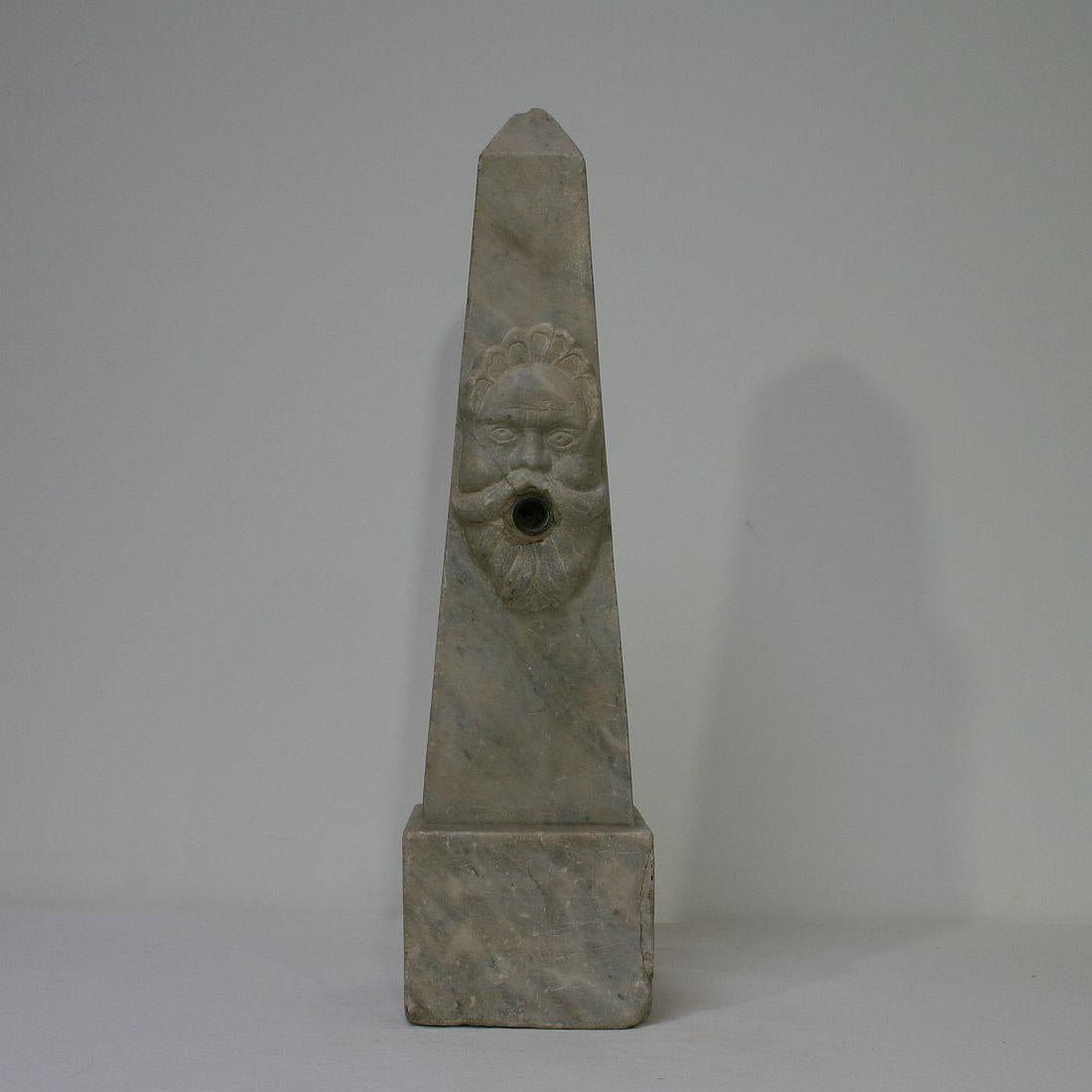 Spectacular and unique marble obelisk with a fountain head.
Italy, circa 1750.
Weathered, small losses.
 