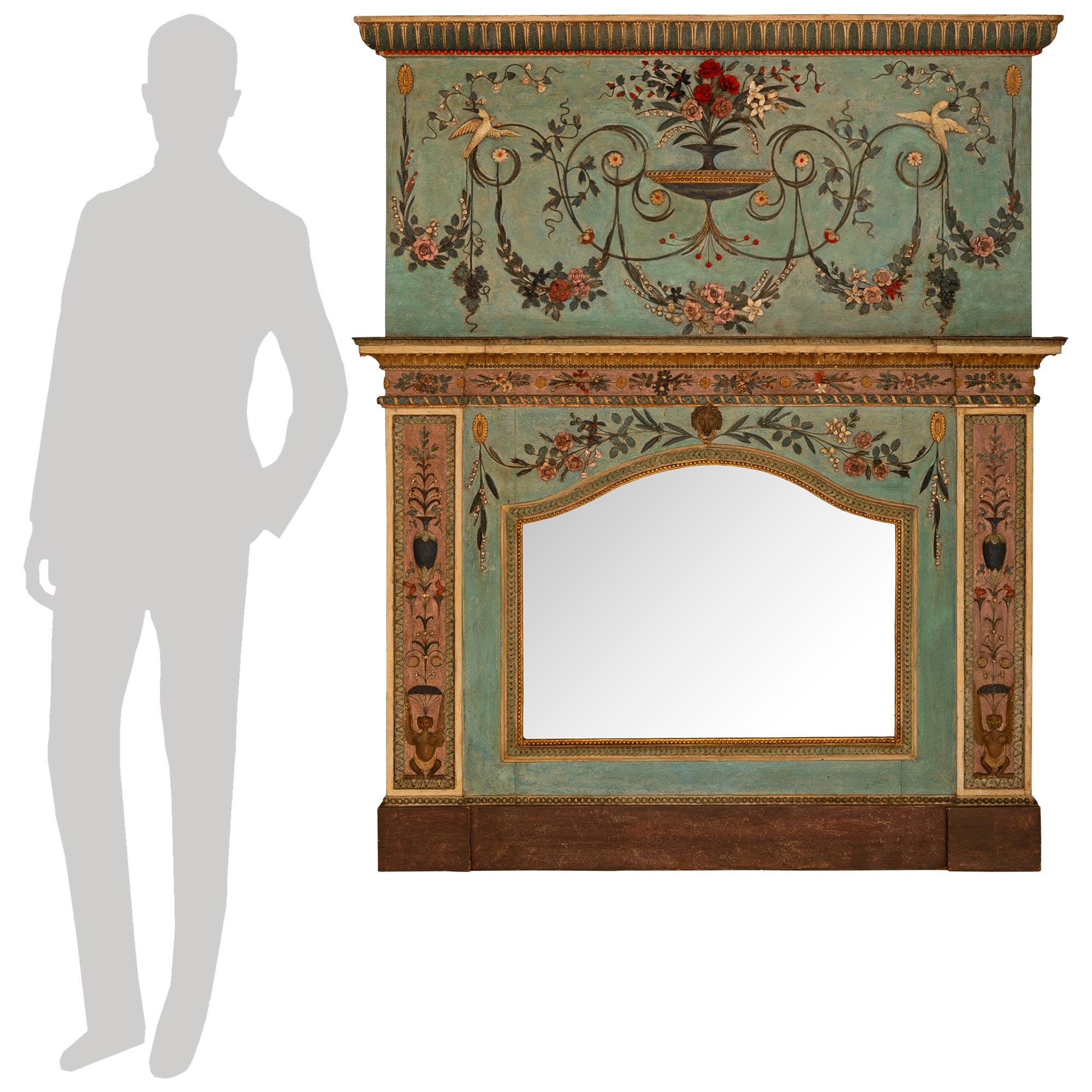 Un superbe et très décoratif miroir milanais du XVIIIe siècle de style Saint-Trumeau. Ce Trumeau magnifiquement coloré repose sur une longue base rectangulaire patinée avec des socles à chaque extrémité. Au-dessus de chaque socle se trouve un
