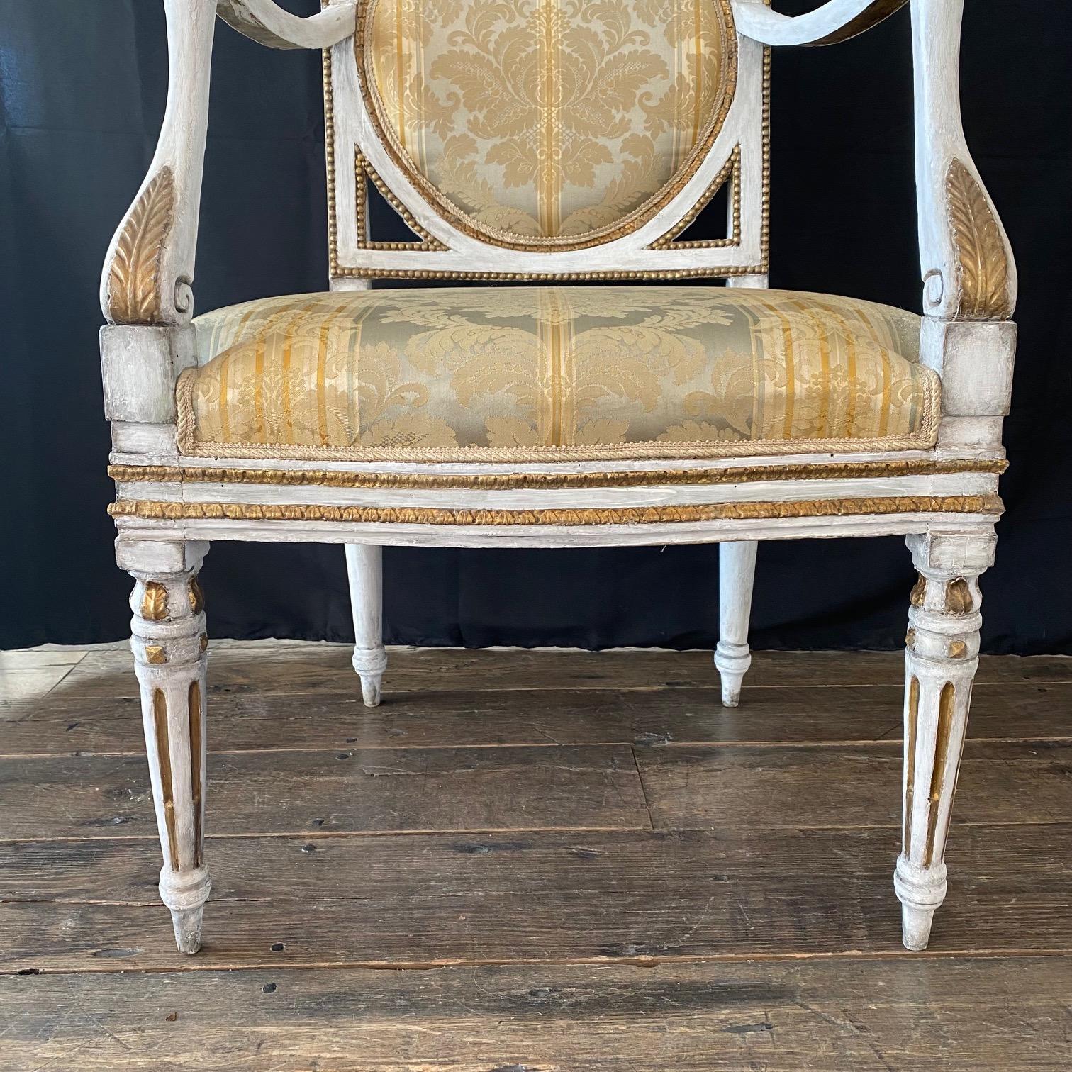 Elegant and classic 18th century authentic Italian neoclassical pair of armchairs or fauteuils from a salon set (matching sofa available). Upholstered in a stunning neutral raw-silk with original paint. In wonderful shape for its age (a few minor