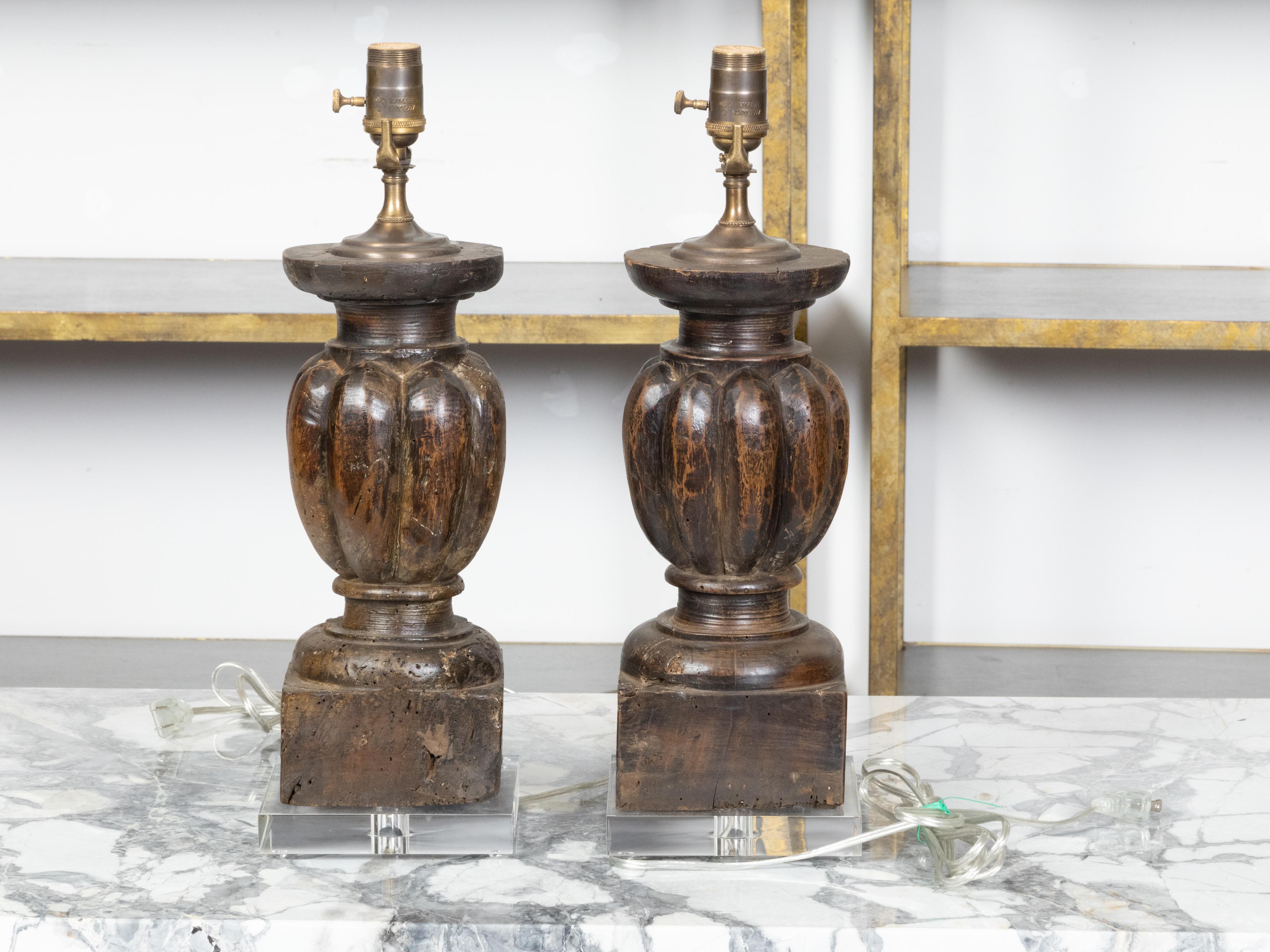 Carved Italian 18th Century Pair of Baluster Fragments Made into Wired Lamps on Lucite For Sale