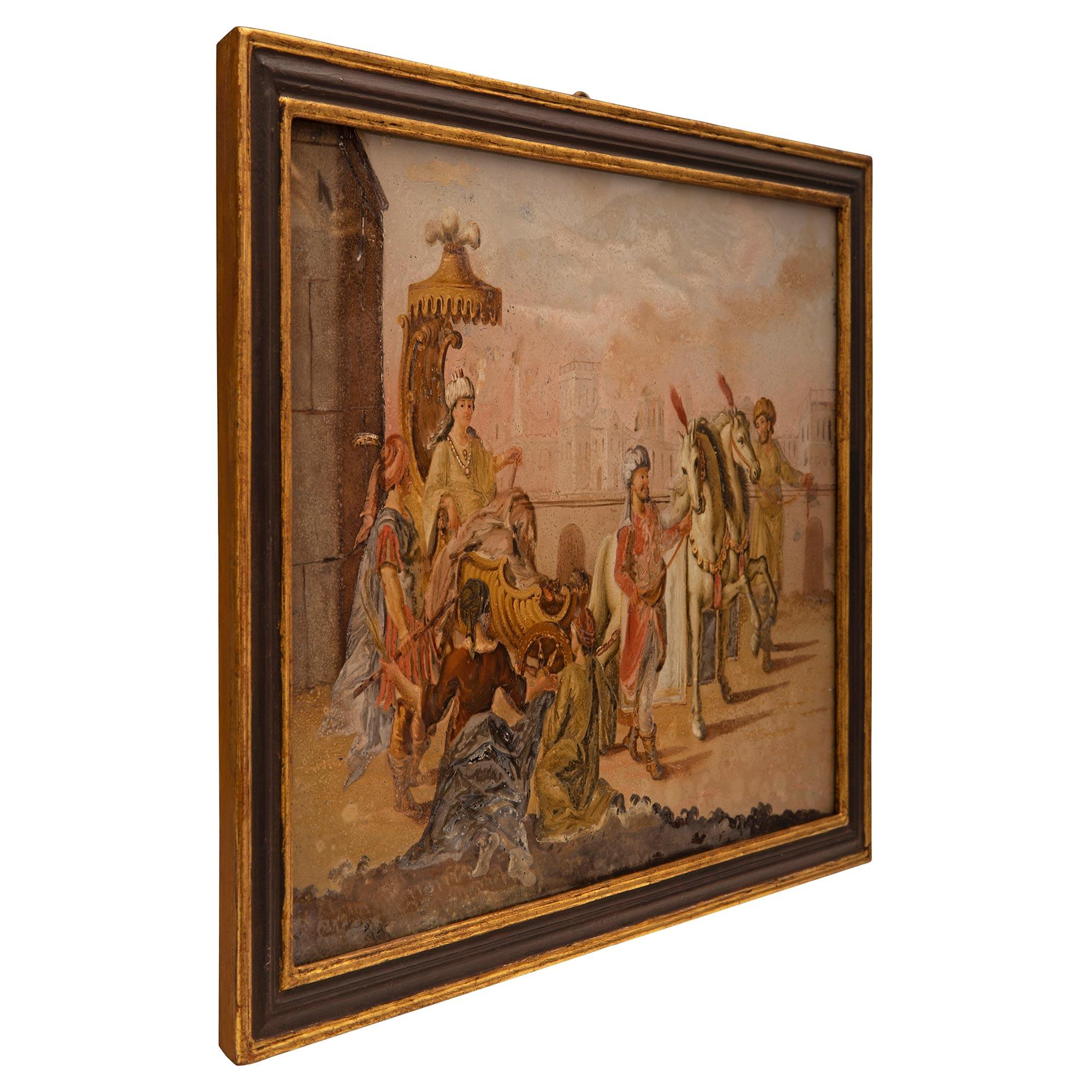 Superbe tableau italien du XVIIIe siècle peint à l'envers sur verre dans son cadre d'origine. Le tableau est placé dans son cadre d'origine, très élégant, en bois polychrome et doré, au motif finement marbré. La peinture représente une célébration