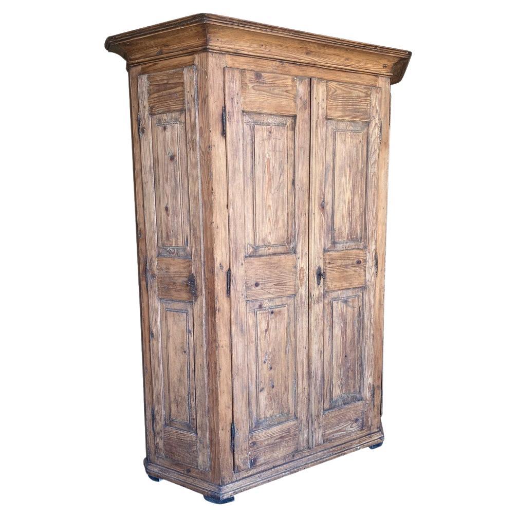 A very handsome 18th century canted side - Scantonata - Armoire from the Veneto region of Italy.  Beautifully constructed from hard pine with 4 doors and interior shelving.  Several shelves on the left side have been cut back to house riffles. 