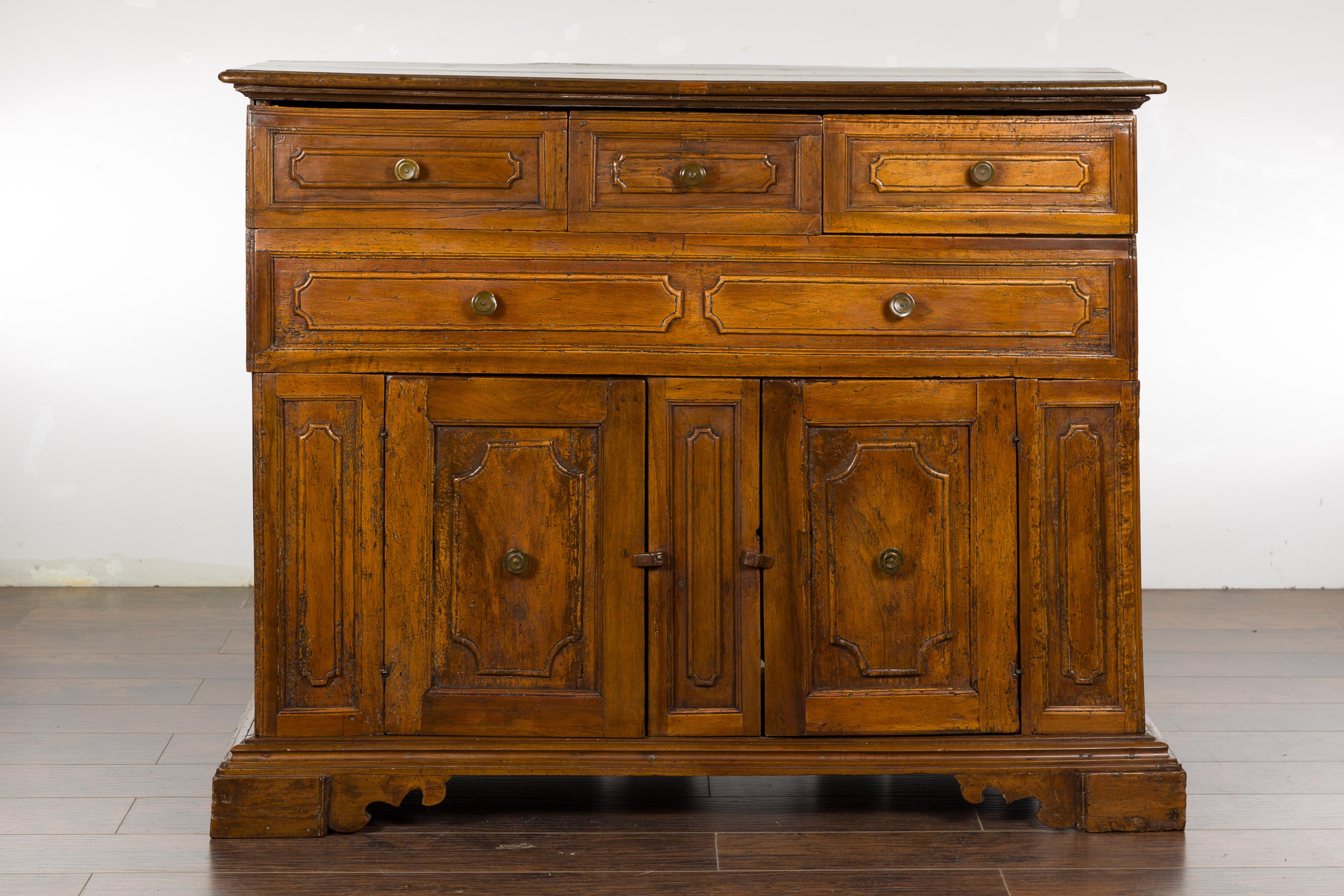 Carved Italian 18th Century Walnut Credenza with Four Drawers, Two Doors, Bracket Feet For Sale