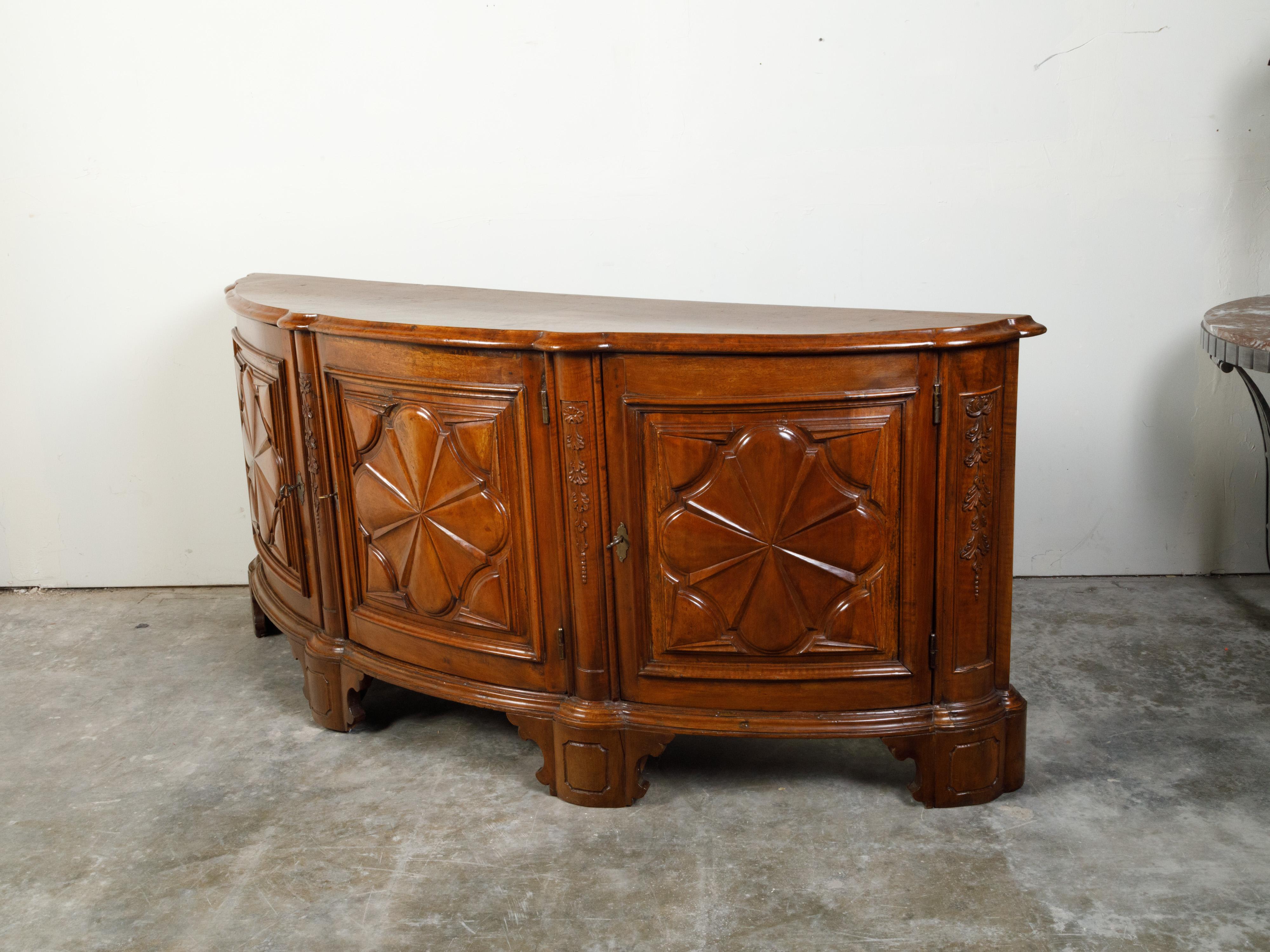 18th Century and Earlier Italian 18th Century Walnut Demilune Credenza with Carved Quatrefoil Style Doors