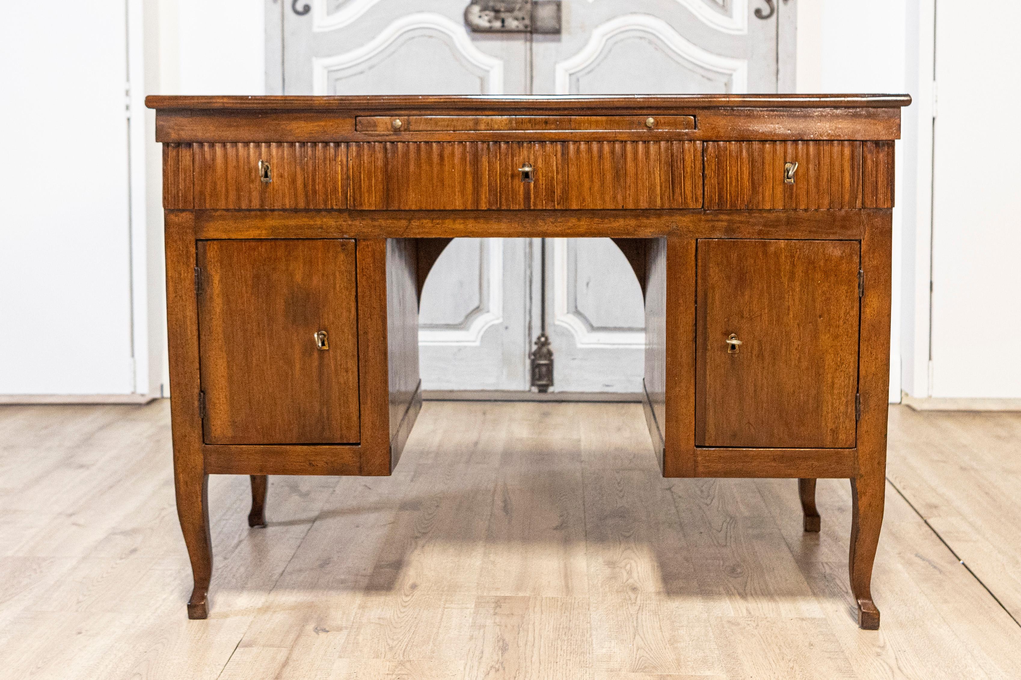 18th Century and Earlier Italian 18th Century Walnut Desk with Carved Reeded Apron, Drawers and Doors For Sale