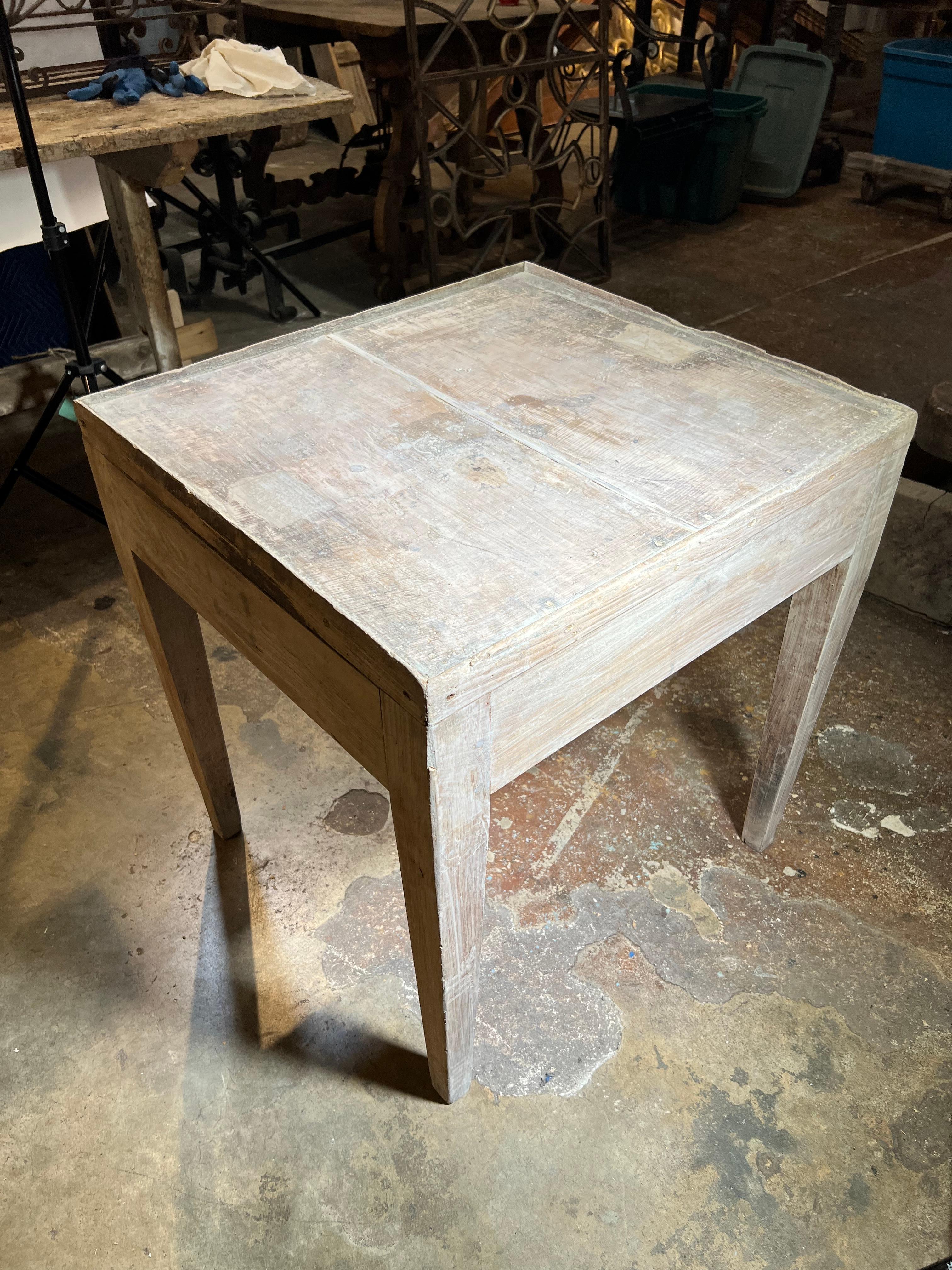 An 18th century rustic side table from the Tuscany region of Italy constructed from naturally washed elm. Handsome patina.