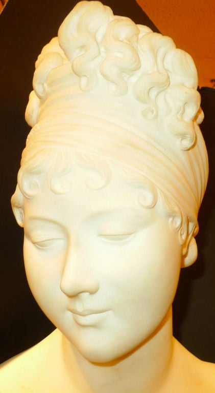 Italian 19th century Neoclassical Carved Marble Bust of Madame de Recamier, an infamous Napoleonic era beauty. She refused to be a lady in waiting to Empress Josephine and was immortalized in a very famous portrait by Jacques Louis David.