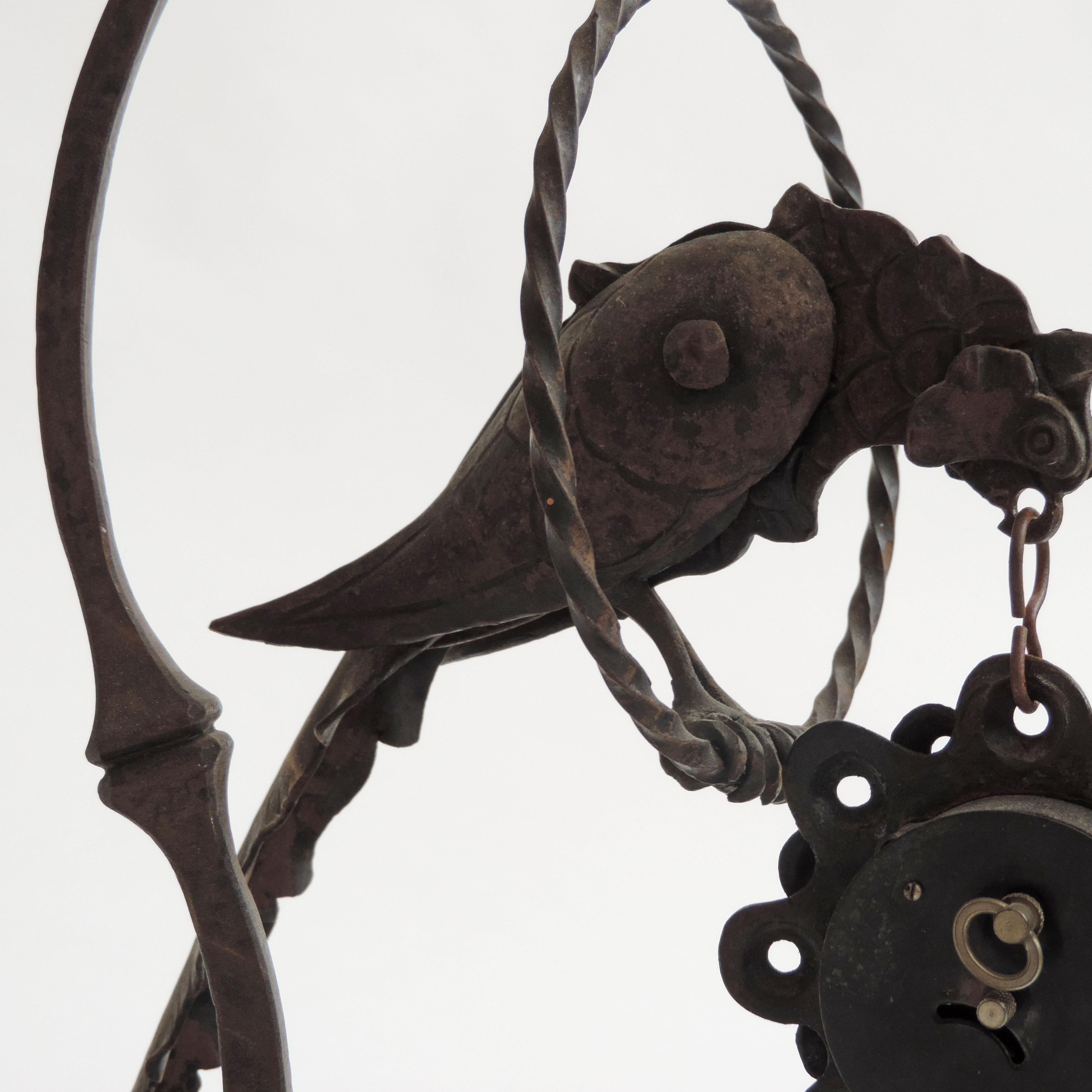Italian 1920s Art Deco Wrought Iron Bird Holding a Clock In Good Condition In Milan, IT