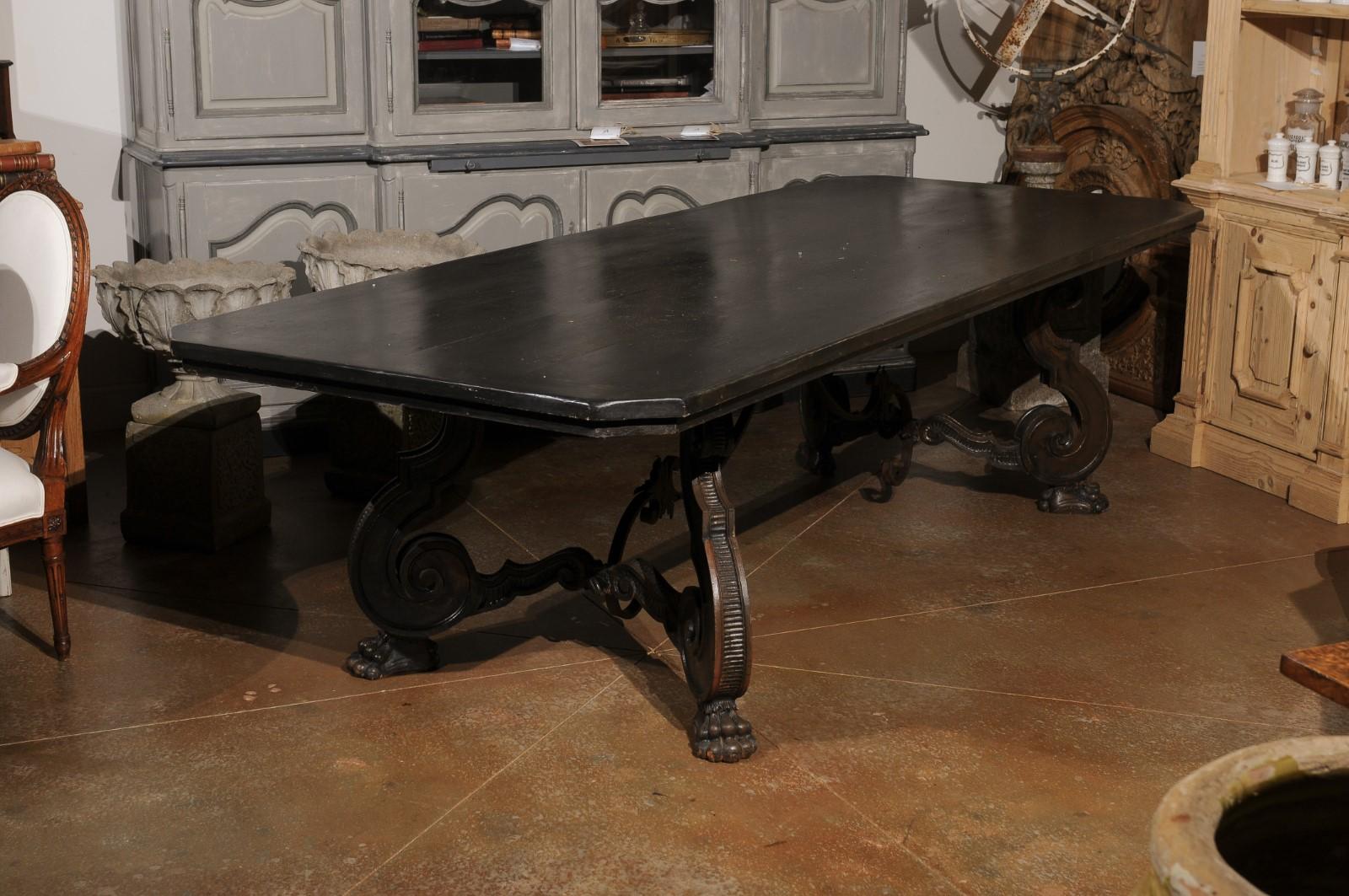 20th Century Italian 1920s Ebonized Walnut Dining Table with Carved S-Scroll Legs on Paw Feet For Sale