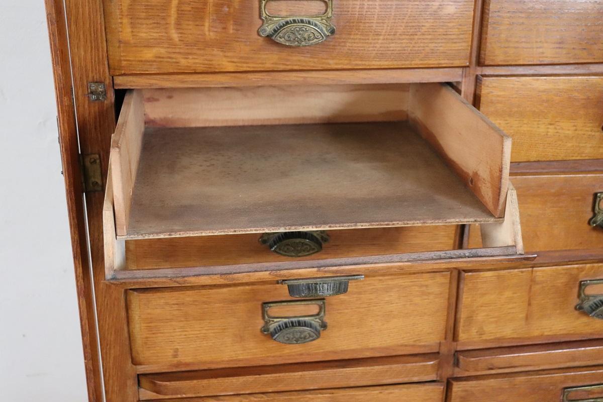 Italian 1920s Oak Wood Apothecary / Filing Cabinet, 18 Drawers and Shutter door For Sale 12