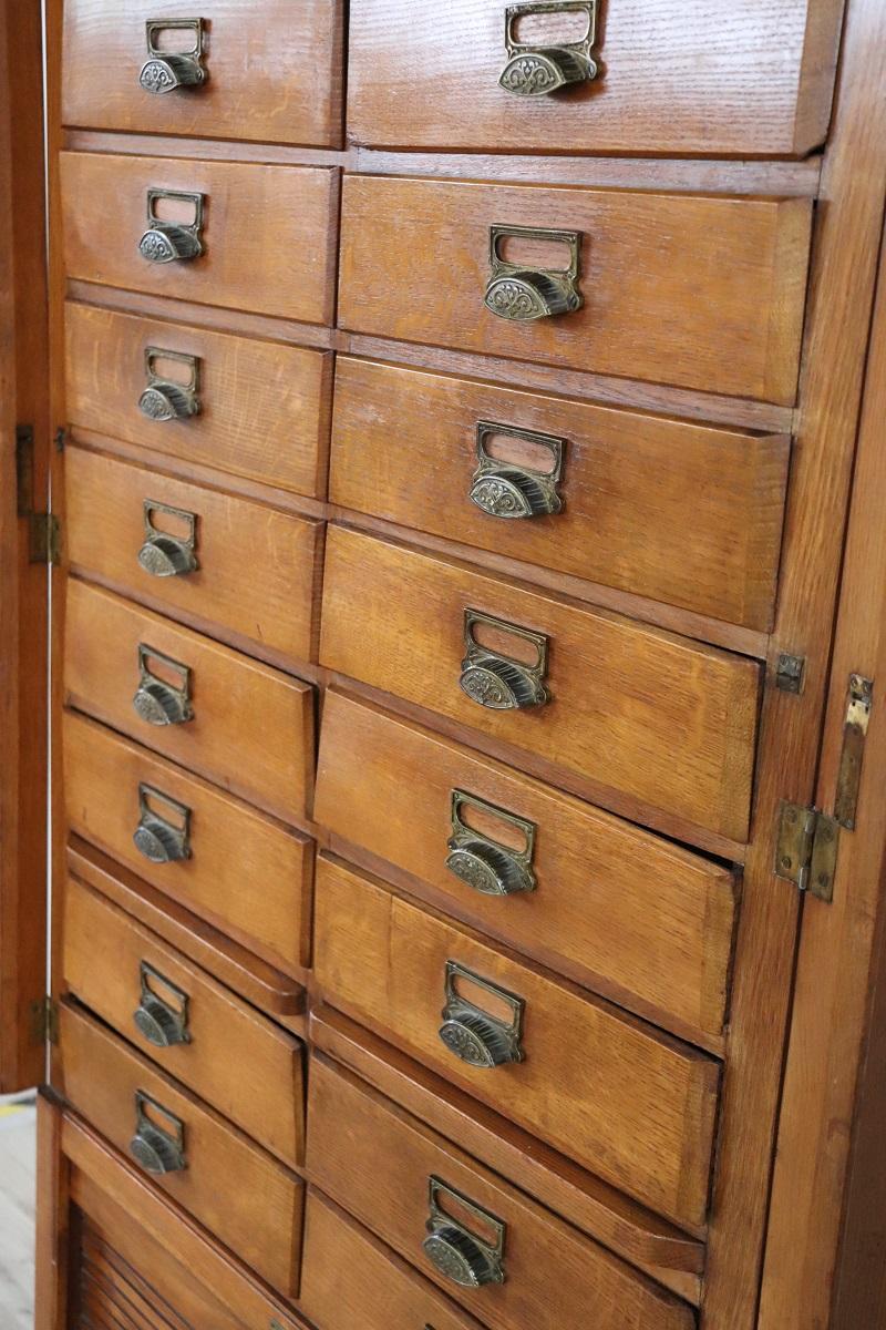 Italian 1920s Oak Wood Apothecary / Filing Cabinet, 18 Drawers and Shutter door For Sale 15