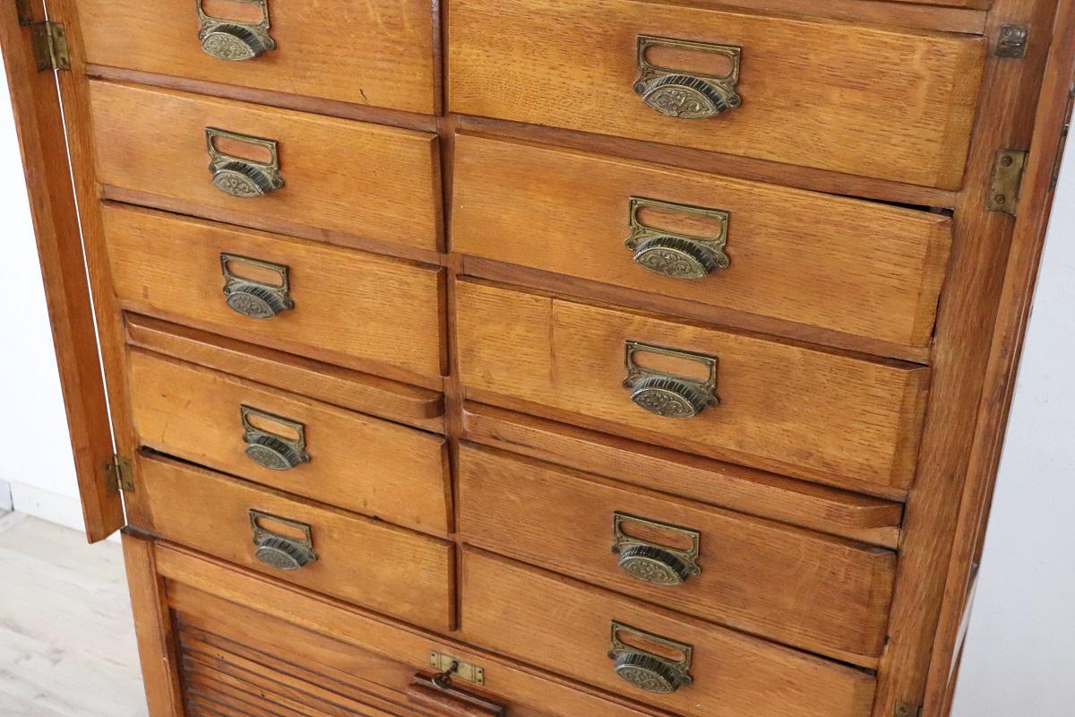 Early 20th Century Italian 1920s Oak Wood Apothecary / Filing Cabinet, 18 Drawers and Shutter door For Sale