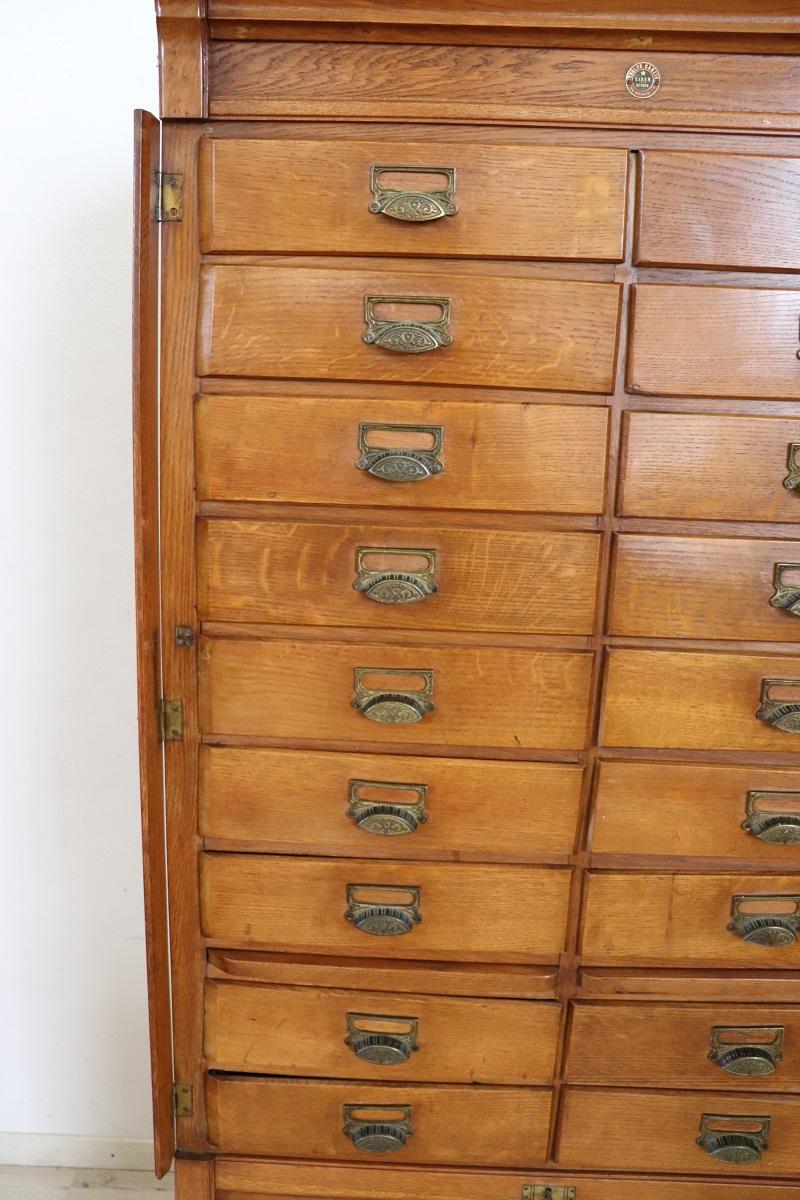 Italian 1920s Oak Wood Apothecary / Filing Cabinet, 18 Drawers and Shutter door For Sale 3