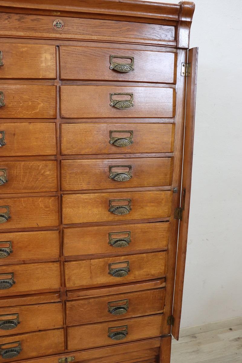 Italian 1920s Oak Wood Apothecary / Filing Cabinet, 18 Drawers and Shutter door For Sale 4