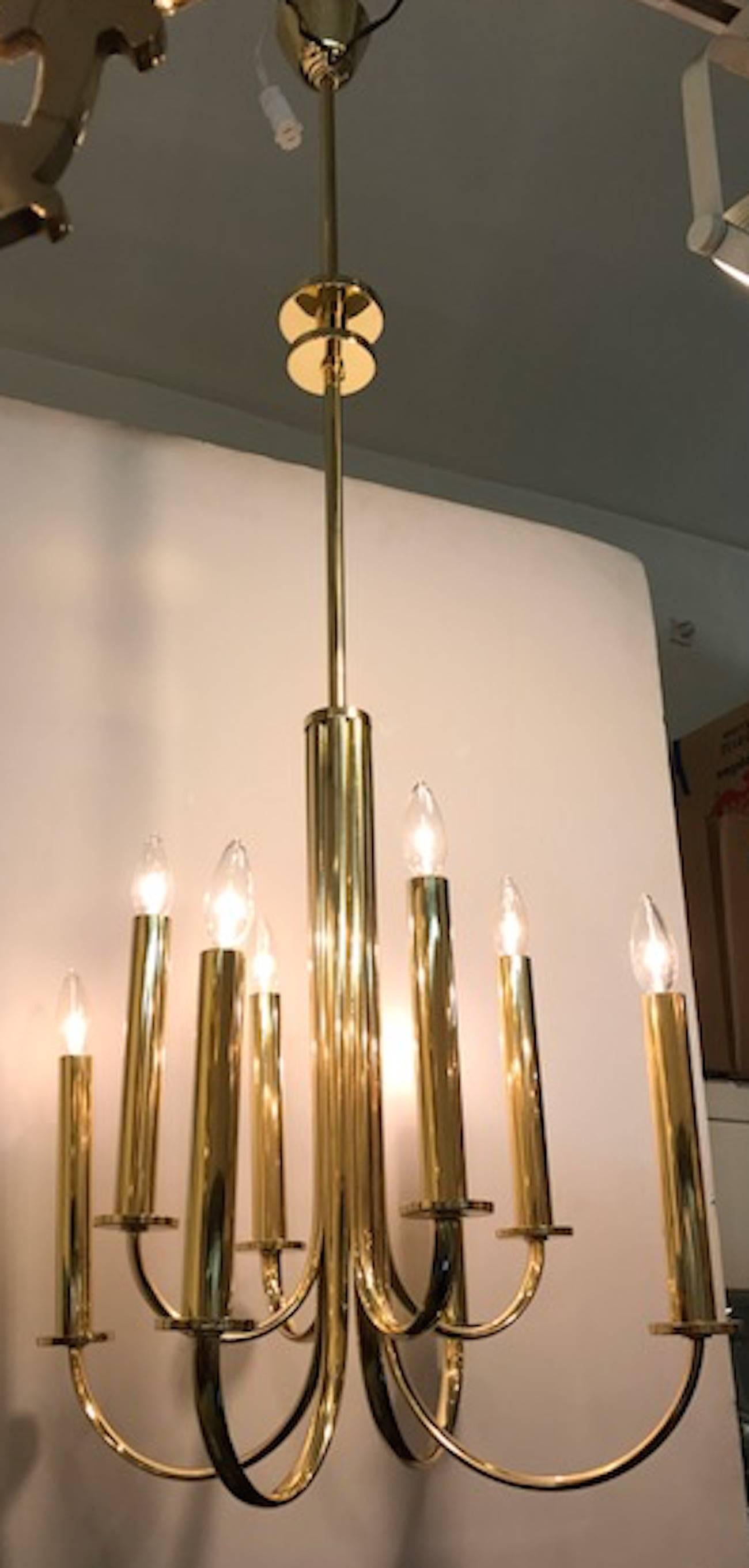 A wonderful example of Italian 1930s Art Deco lighting in an elegant and clean design. A total of eight arms laid out in a square format when seen from below. Four shorter inner arm alternate with four wider outer arms. Two lovely decorative disks