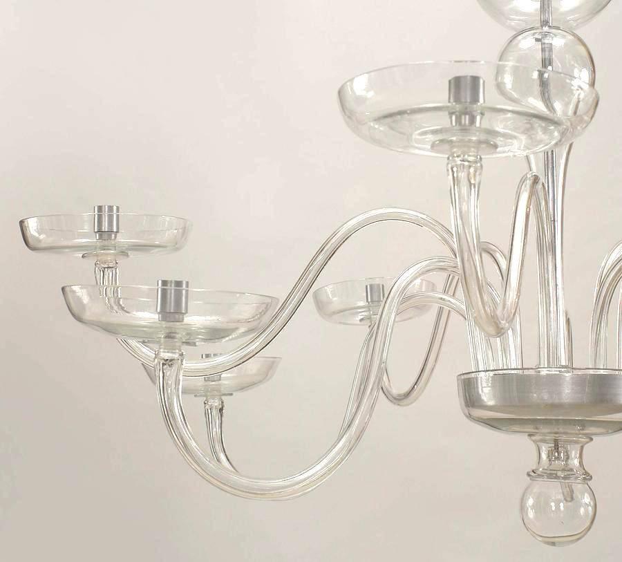 Italian Murano (1930's) clear glass chandelier with 10 scroll design arms of alternating height supporting a large round bobeche. (att: A. SEGUSO)
