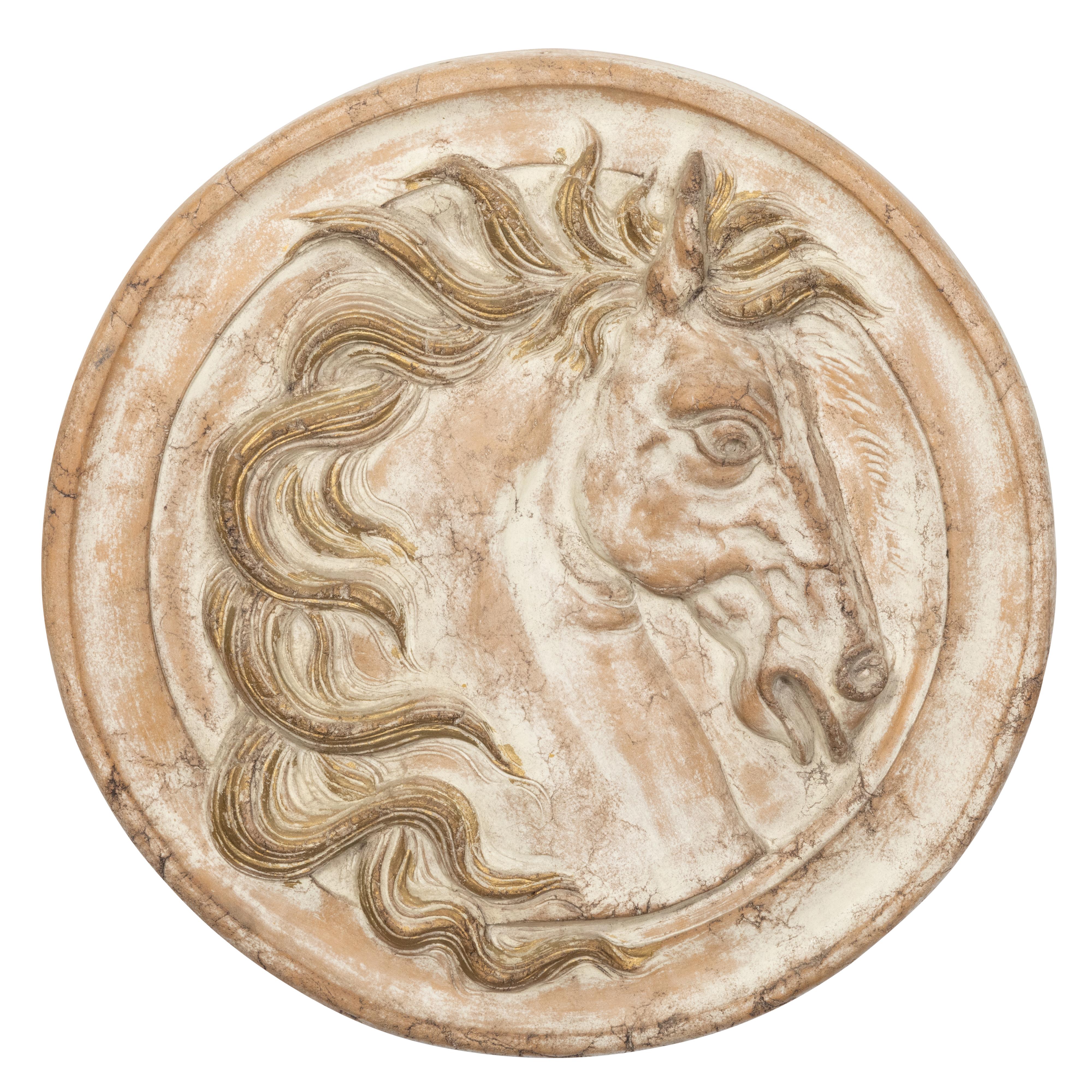 medallion with head carved in relief
