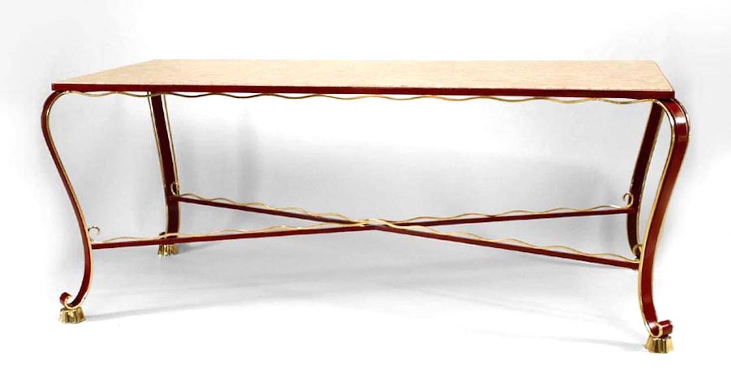 Italian 1930s red lacquered iron dining table with brass trimmed apron, stretcher, and legs with cabriole design and inset marble top (Design attributed to EDOARDO PERSICO).
 