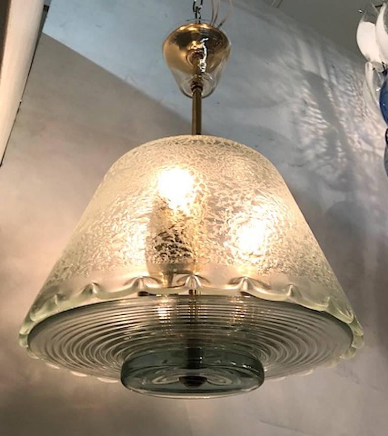 Italian pendant light with blown glass and acid etched shade, circa 1940. Complete with original matching top ceiling cap, decorative blown glass bead atop shade and molded ribbed bottom dish. Brass rod and mounts. Shade houses three standard light
