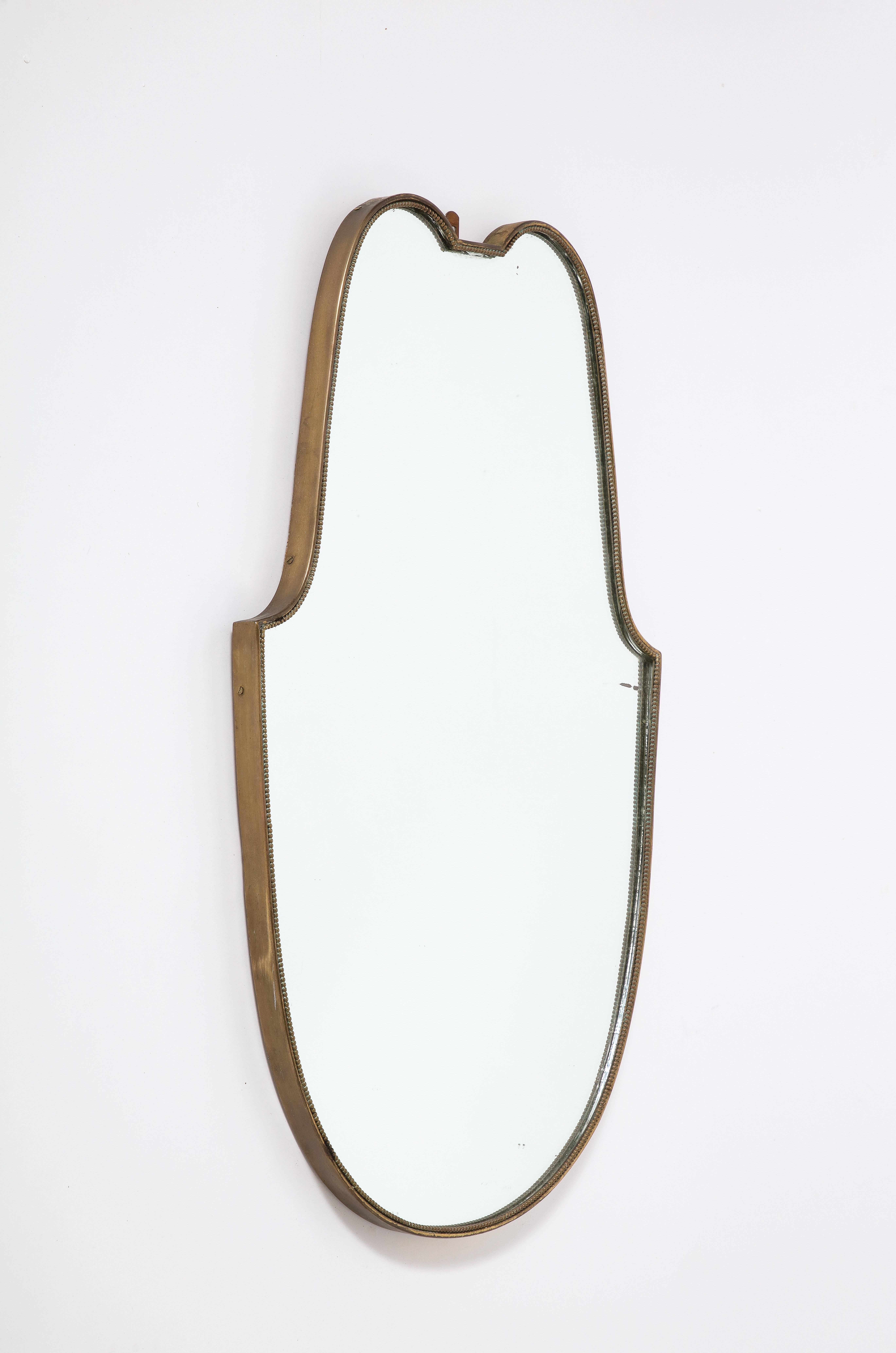 Italian 1940's Brass Shield Shaped Mirror with Beaded Trim, Italy, circa 1940  In Good Condition For Sale In New York, NY