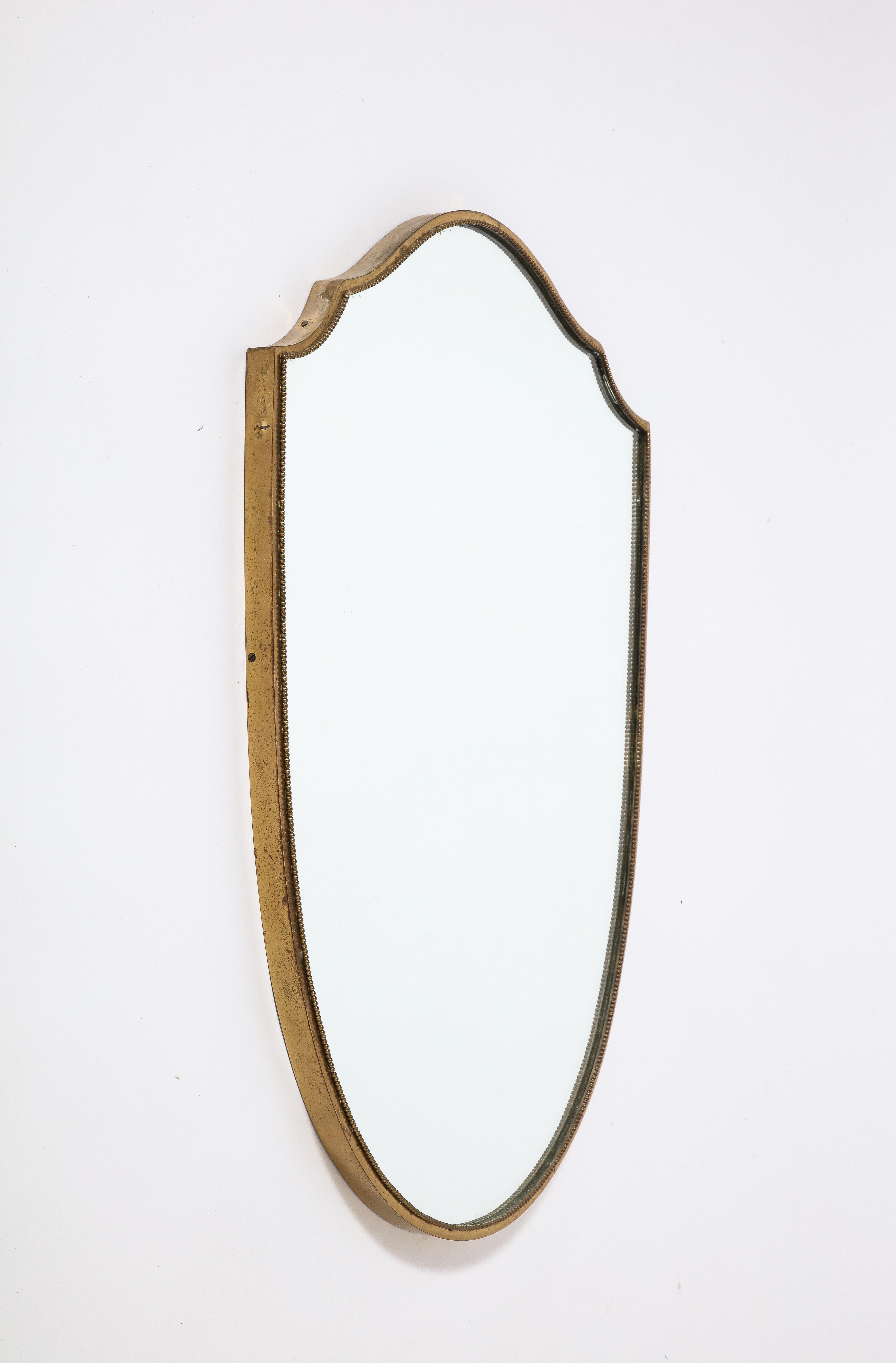 Italian 1940's Brass Shield Shaped Mirror with Beaded Trim, Italy, circa 1940  In Good Condition In New York, NY