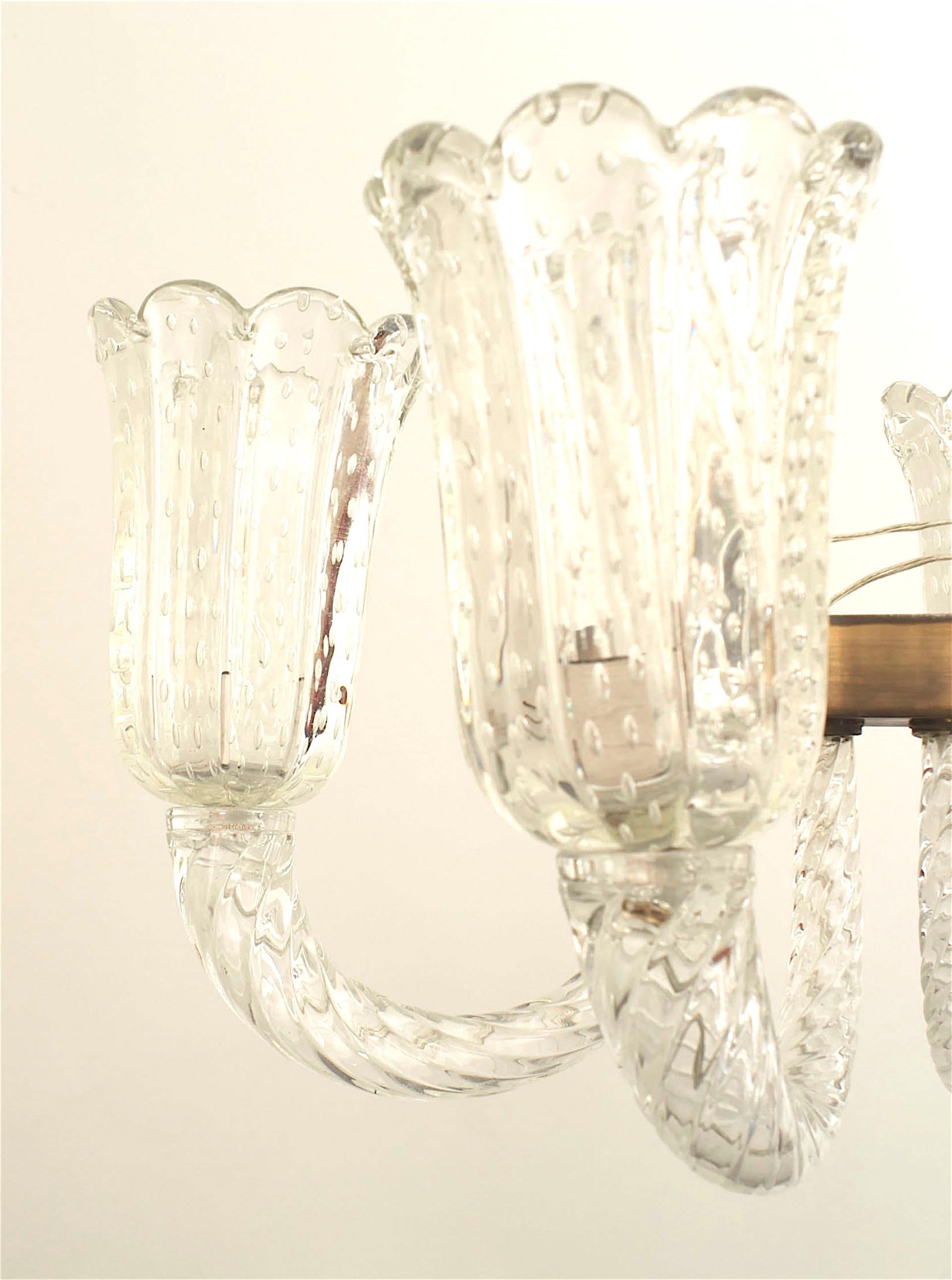 Italian 1940s chandelier with a brass horizontal frame supporting 6 swirl clear glass arms holding large internal bubble fluted & scalloped top glass shades suspended by a swirl centerpost. (by BAROVIER ET TOSO)
