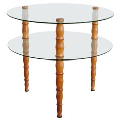 Mesa de centro italiana de los años 40 circular de dos pisos de cristal y madera torneada