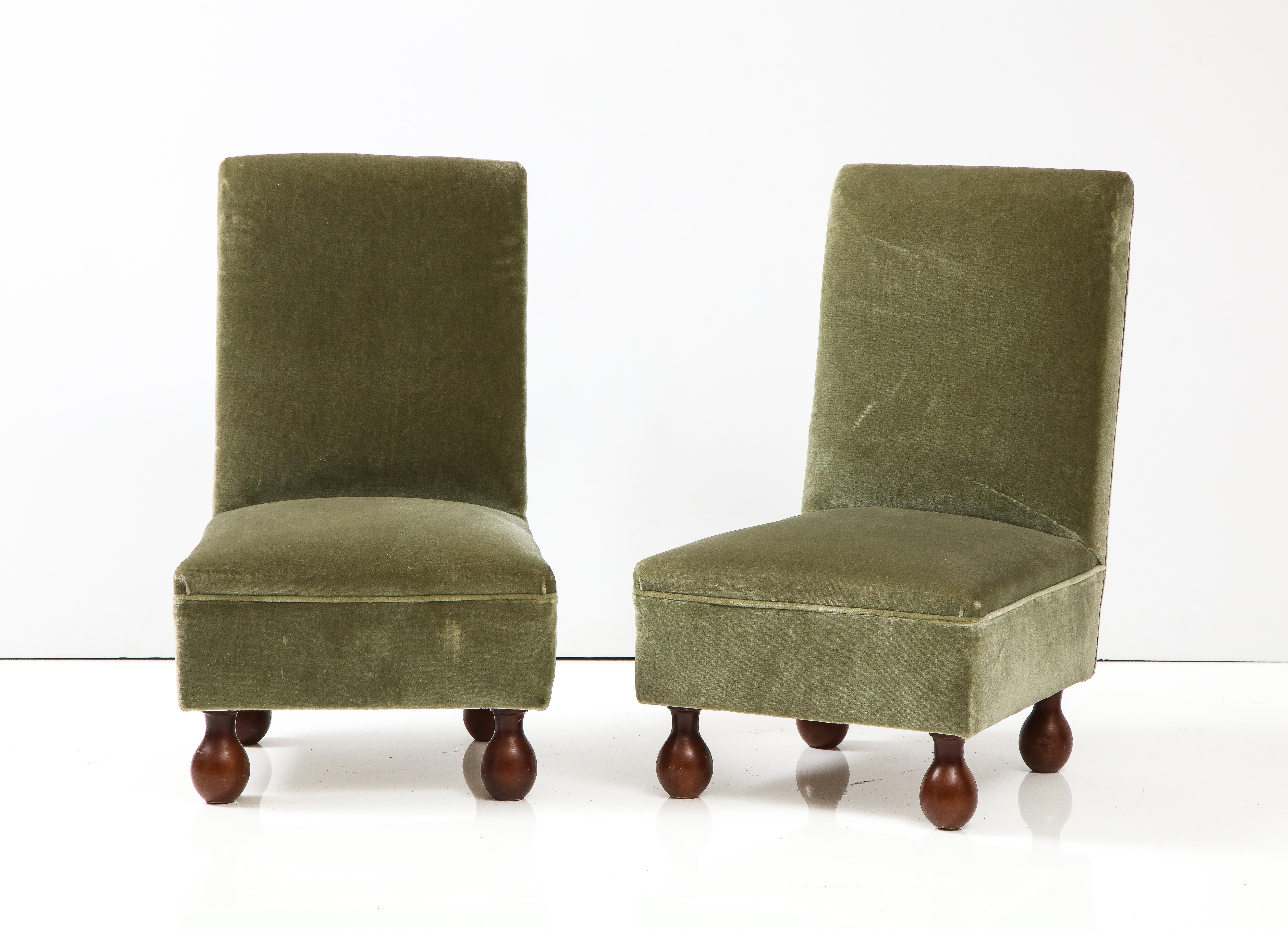 A charming Italian 1940's living room suite, encompassing a sofa, pair of armchairs and a pair of slipper chairs; all upholstered in their original seafoam green velvet, with beautifully curved arms, rectangular backs; supported on walnut bun feet.
