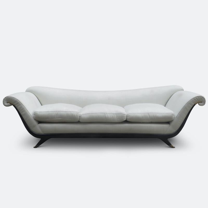 A beautiful long sofa attributed to Guglielmo Ulrich, the master of Italian classicism. This sofa is an exceptional example of Ulrich's architectural skill where line becomes form and back again.
The sofa has a wonderful downward and elongated curve