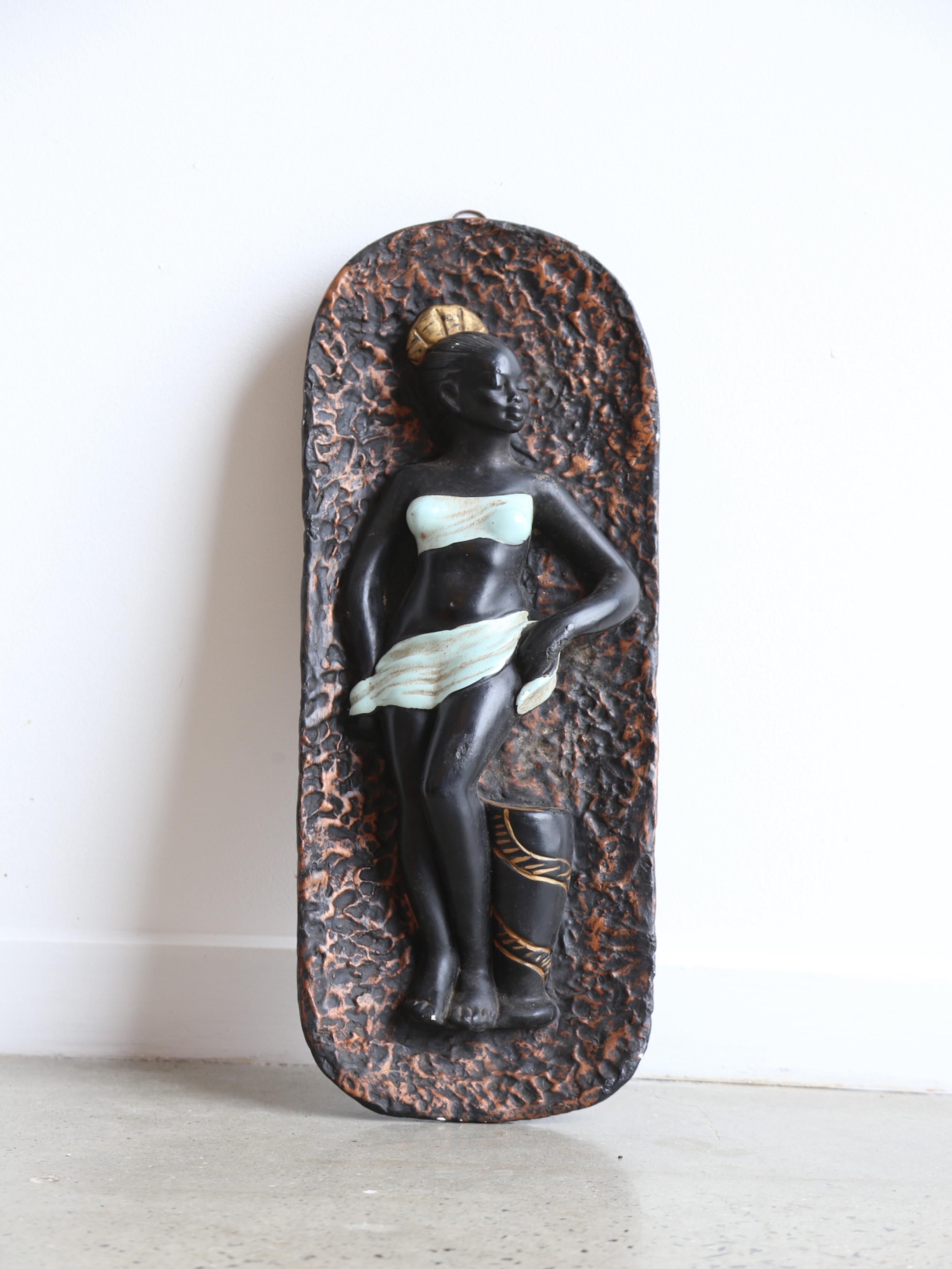 The Italian 1950 plaster wall decoration of an African dancer is a beautiful and unique piece of art from the mid-20th century. The decoration is made from plaster, a Material that has been used in art and architecture for centuries, and it is a