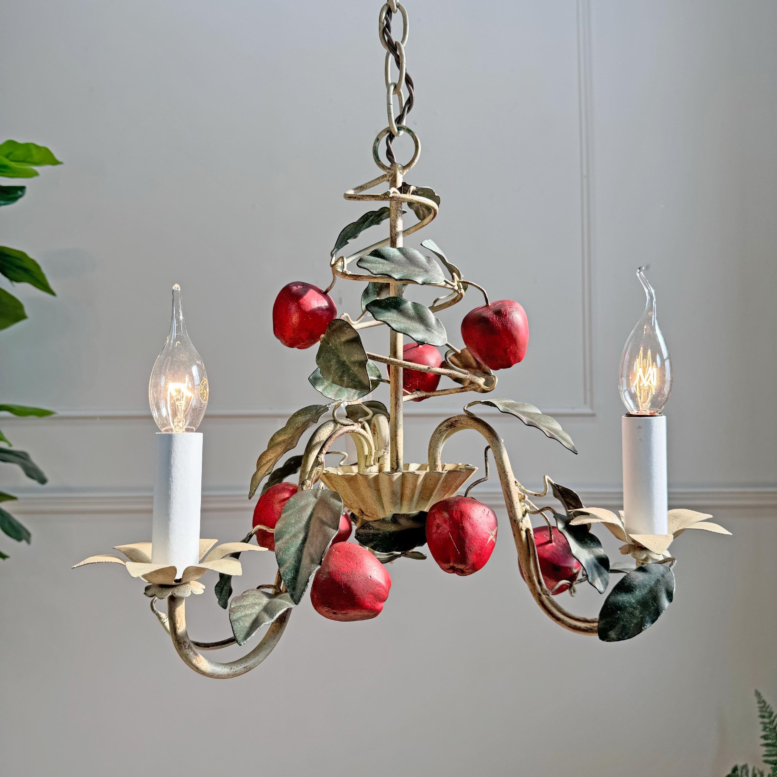 A beautiful and rare 1950's Italian hand painted chandelier, this captivating light, in the form of large red Apples and leafy foliage. In bright red, cream, and natural green tones.



The light has 3 single e14 (small screw in) lamp