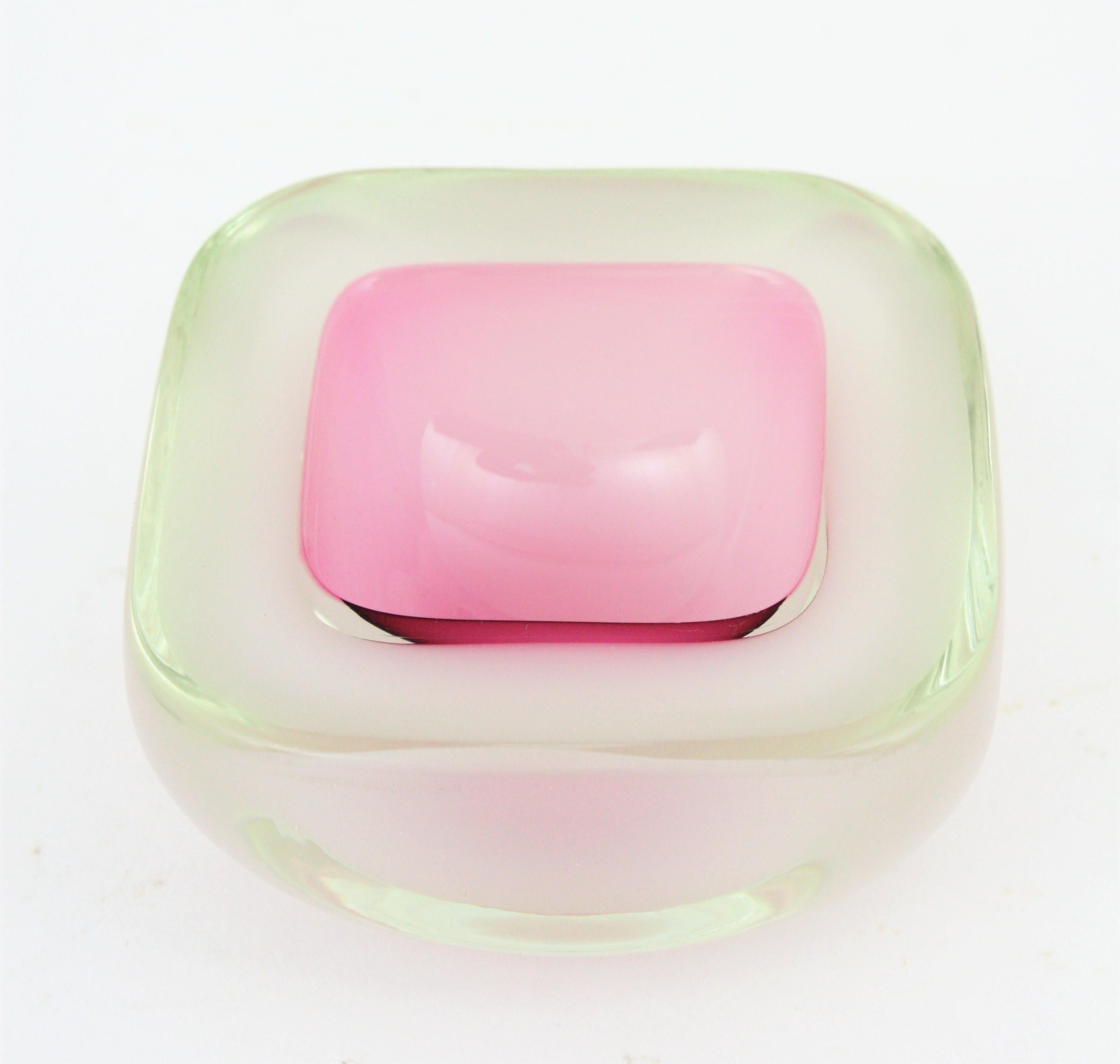 Hand blown Murano glass Sommerso bowl in pink and opalescent white color attributed to Archimede Seguso, Italy, 1950s.
Pink glass and opal white glass cased into clear glass. Lovely to be used as jewelry bowl, rings bowl or ashtray.

 