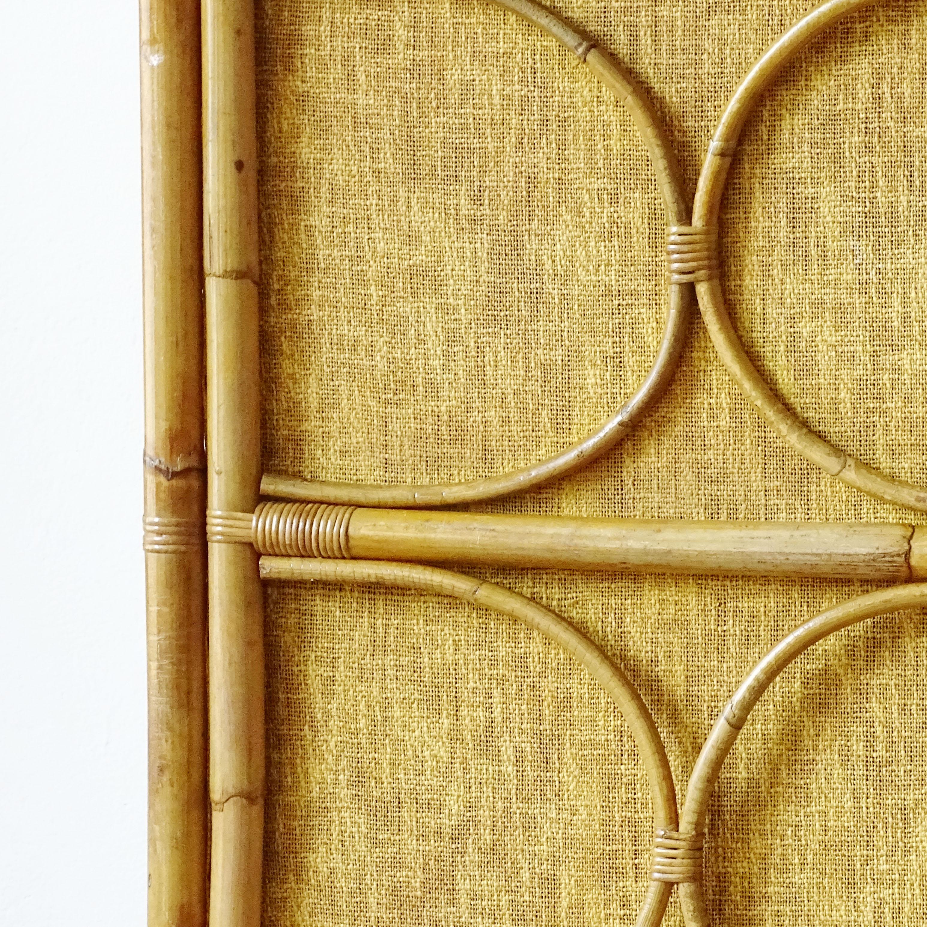 Splendid Italian 1950s bamboo and wicker wardrobe with its original mustard fabric.
An authentic Dolce Vita item to own.