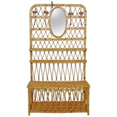 Italian 1950s Bamboo entrance hall coat rack with a mirror, shelves and trunk.