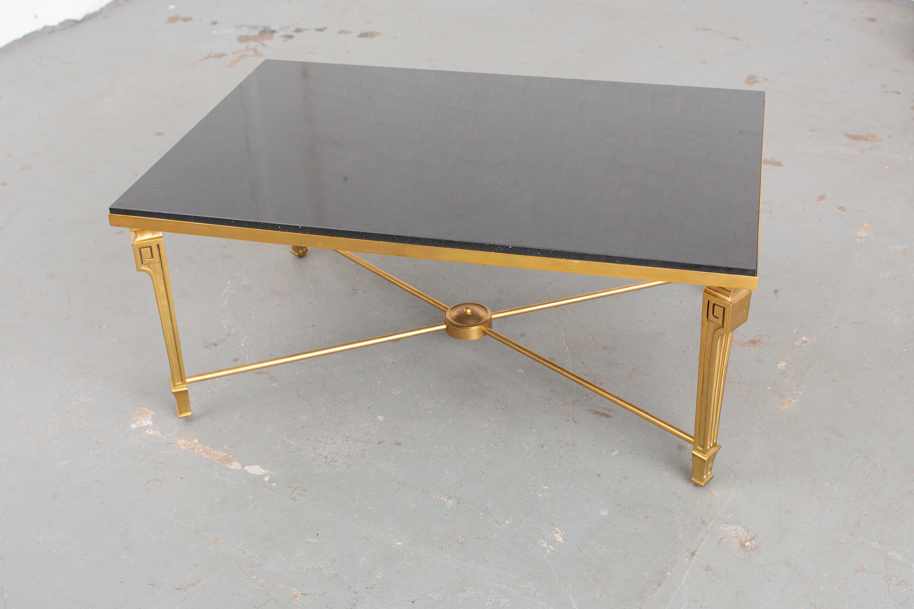 Italian 1950s neoclassical style coffee table with Blackstone top and Greek key detail. Very sturdy and handsome table.