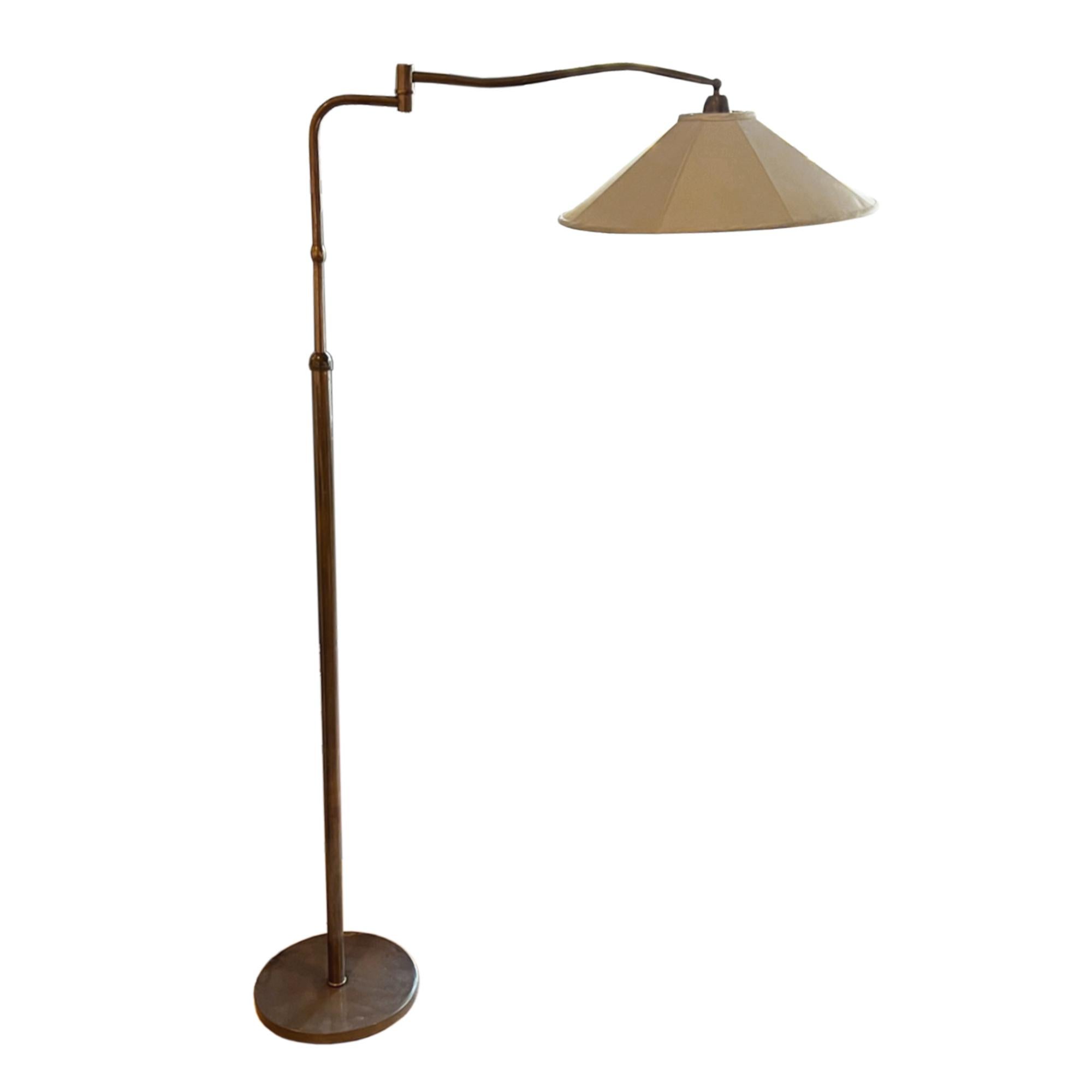 This is a classic Italian floor lamp, with a heavy base and with a moving arm. 

Made from brass which has a deep rose gold patina. 

Fully adjustable, making this lamp practical as well as decorative.

Rewired for the UK using black rope twisted